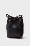 A black Mansur Gavriel Mini Mini Bucket Bag made from Italian Saffiano leather, featuring a drawstring closure and gold-embossed branding near the bottom.