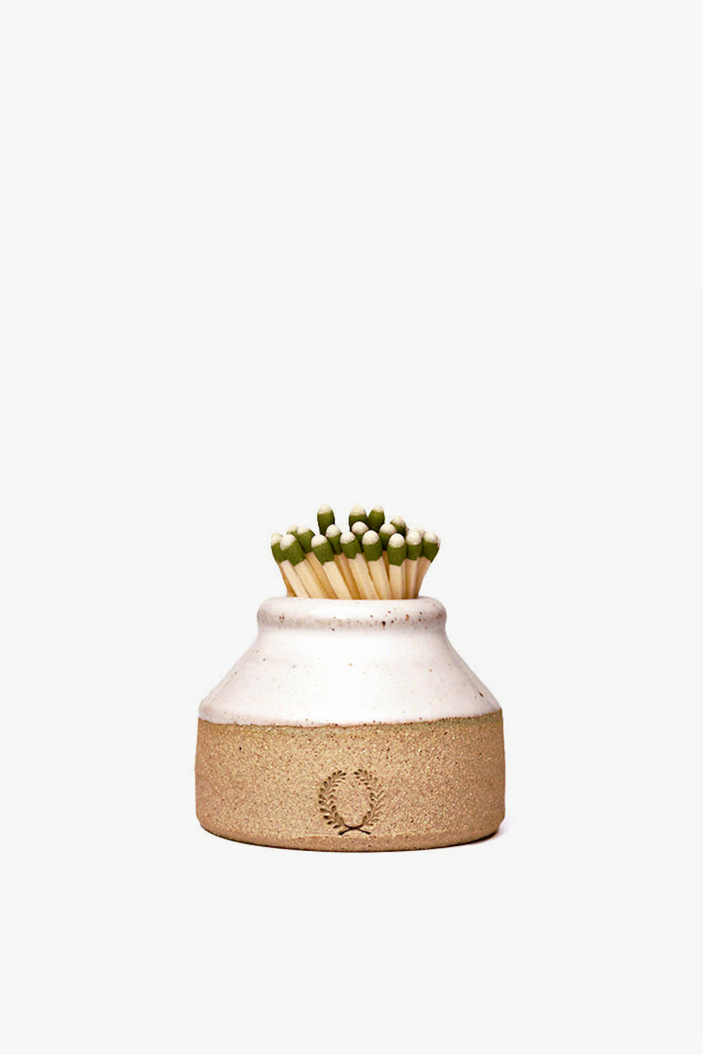 A Farmhouse Pottery, Inc ceramic milk bottle match striker holds green-tipped matches upright and showcases farmhouse style inspired by American stoneware.