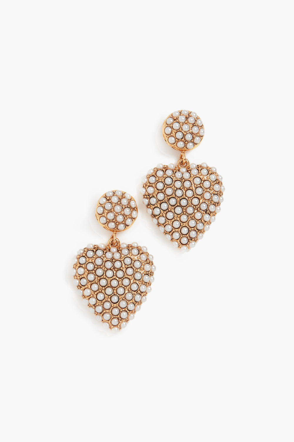 A pair of Jennifer Behr 24k gold-plated heart-shaped earrings features round tops adorned with small white pearls in a honeycomb pattern—ideal luxury accessories.