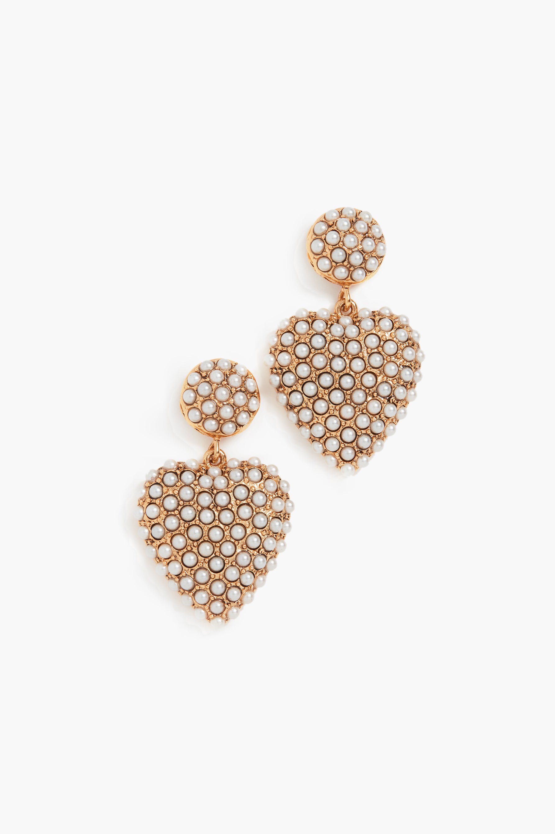 A pair of Jennifer Behr 24k gold-plated heart-shaped earrings features round tops adorned with small white pearls in a honeycomb pattern—ideal luxury accessories.