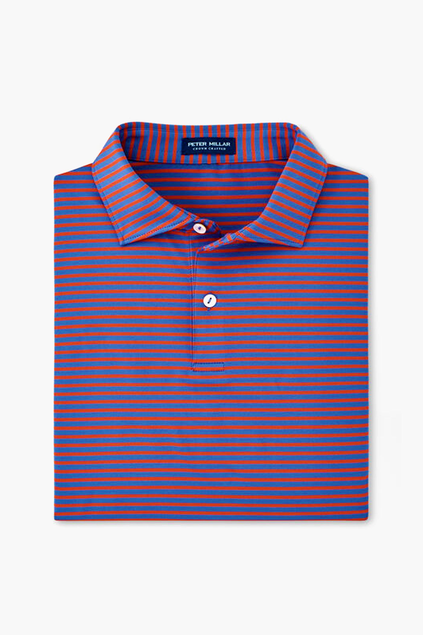 A folded Peter Millar polo shirt with horizontal blue and red stripes, a collar, partial button placket, and four-way stretch for comfort.
