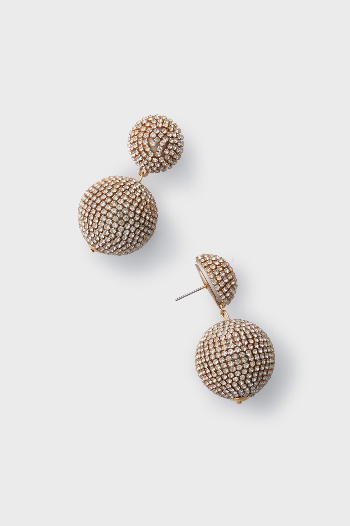 A pair of lantern-style gold drop earrings by Neely Phelan, featuring two spherical beads adorned with small white rhinestones.