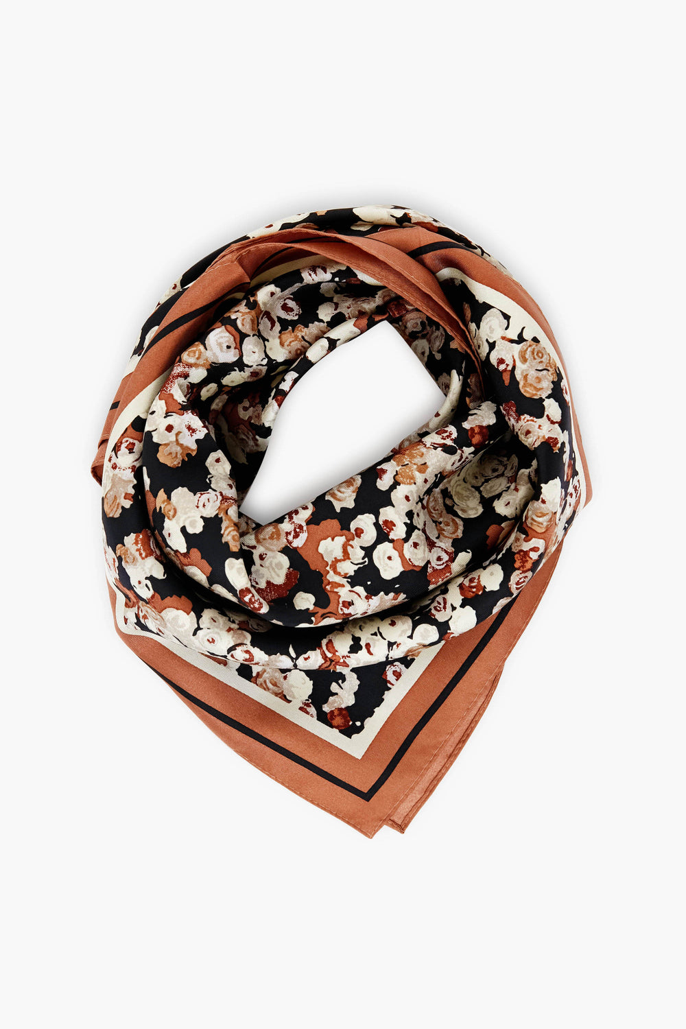 Tuckernuck Accessories square scarf features a floral pattern in black, brown, and cream tones, crafted from 100% silk and neatly folded.