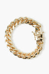 A circular, thick gold plated bracelet by Alexa Leigh featuring a box clasp.