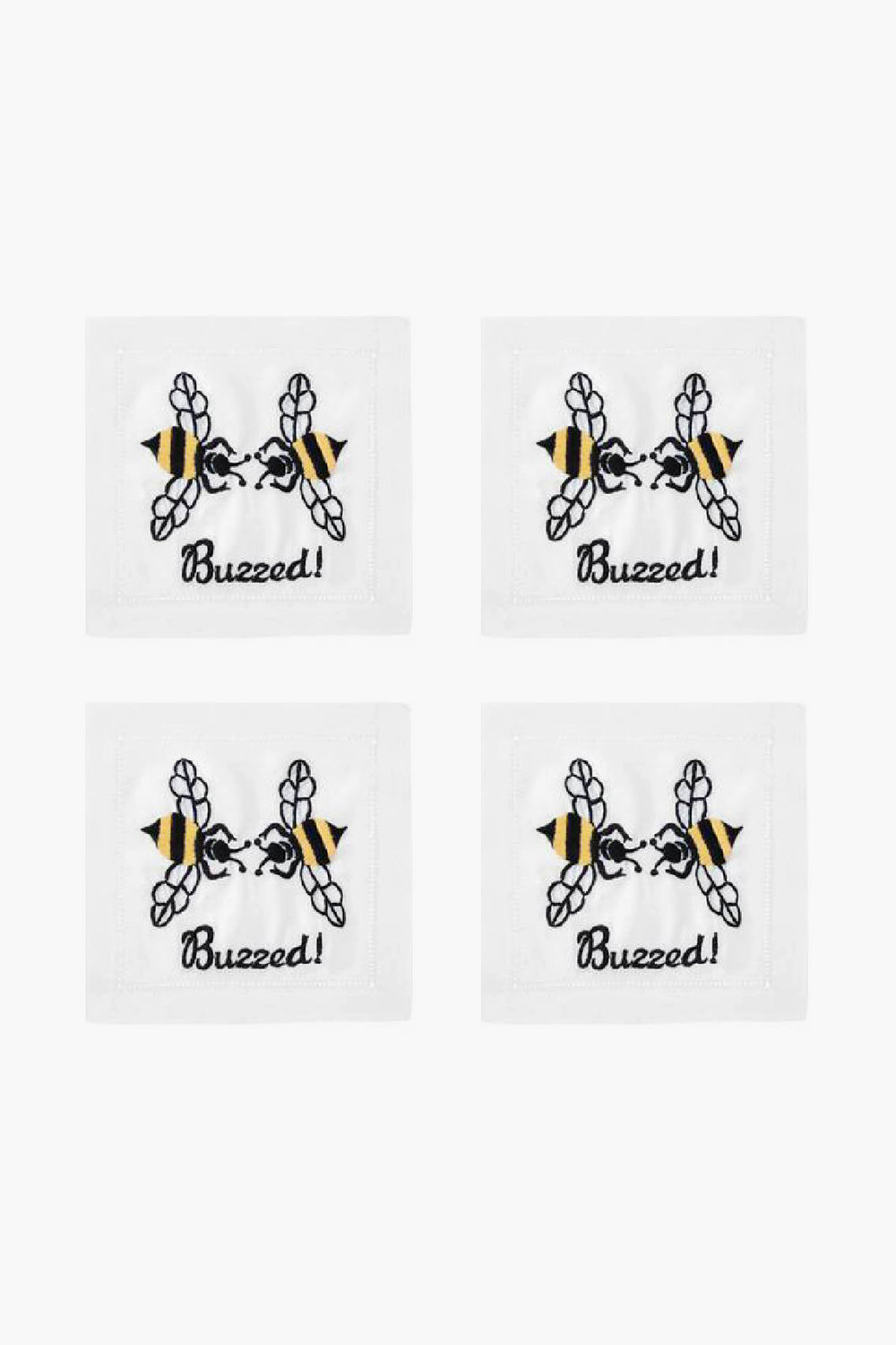 Set of four white August Morgan cocktail napkins, each with an embroidered bee above the word “Buzzed!” in black script—ideal for entertaining guests.