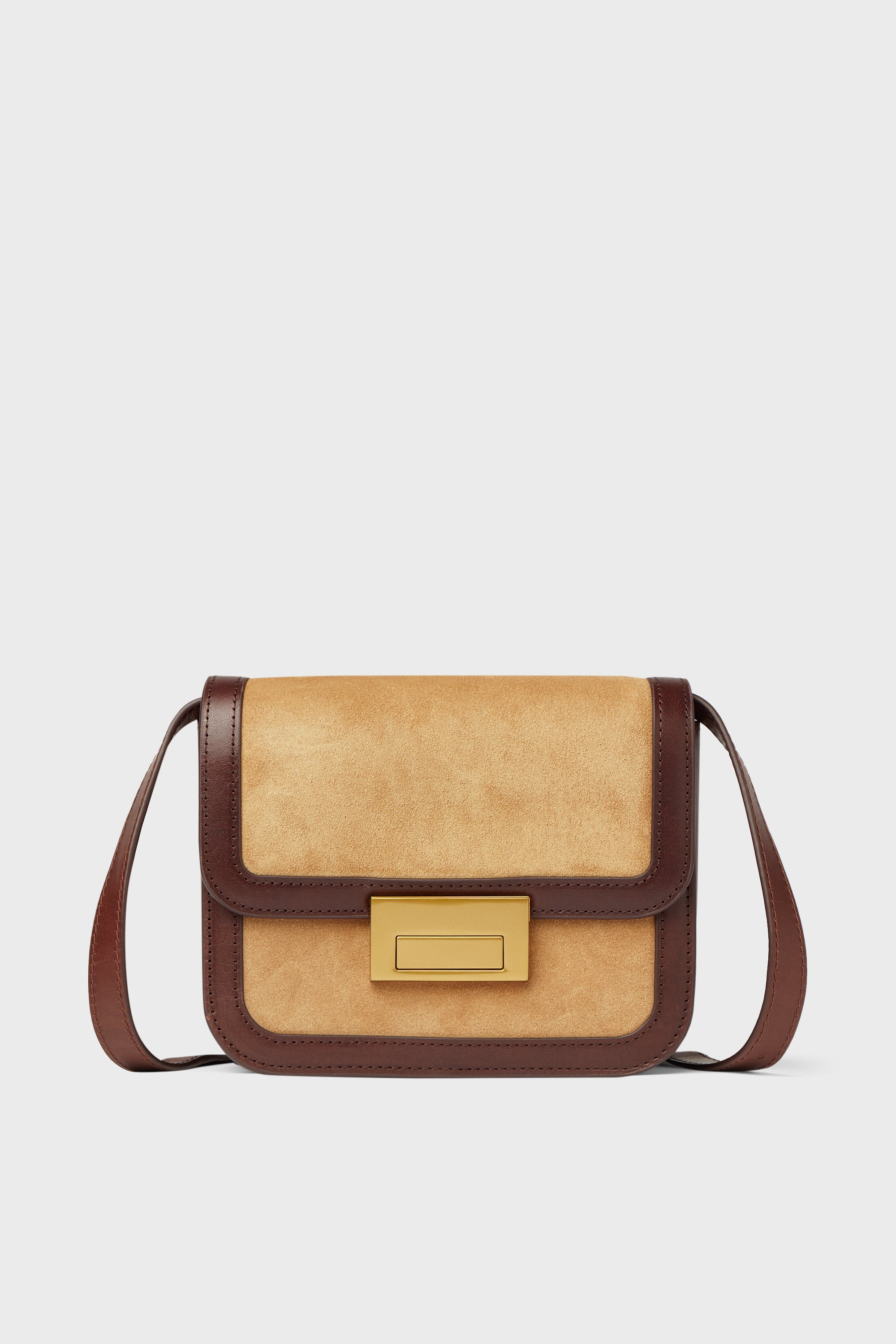 A rectangular tan and brown Loeffler Randall Hazel Desi Bag with a flap closure, gold clasp, and sueded leather—perfect as a chic crossbody.