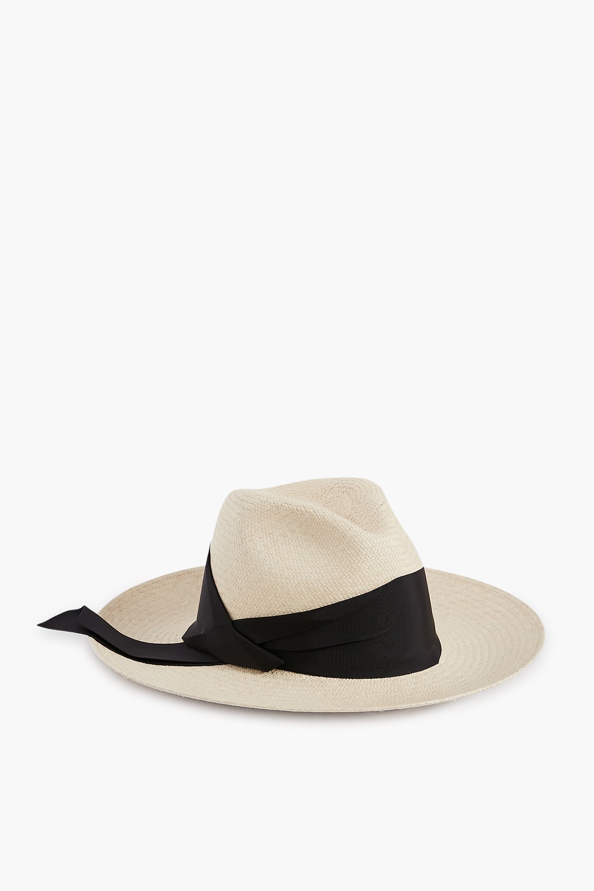 The Freya Panama hat features a wide brim, light color, black ribbon around the crown with a trailing tie, and offers UPF 50 sun protection.