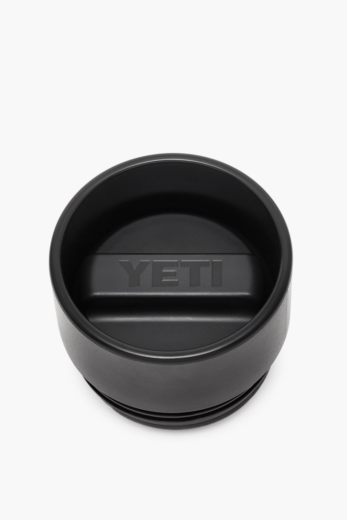 YETI black tumbler lid with a central raised handle and embossed logo, crafted as an insulated, leakproof cap for your Rambler bottle.