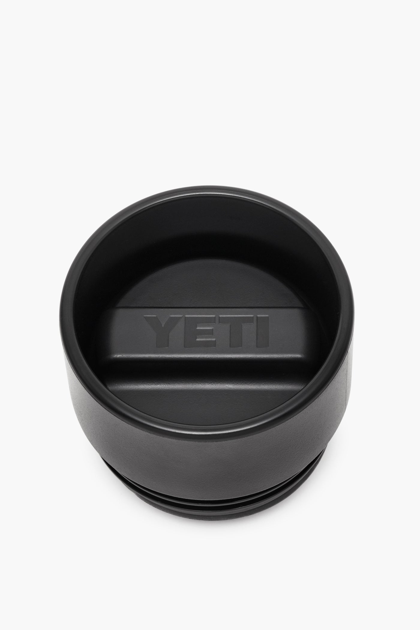 YETI black tumbler lid with a central raised handle and embossed logo, crafted as an insulated, leakproof cap for your Rambler bottle.
