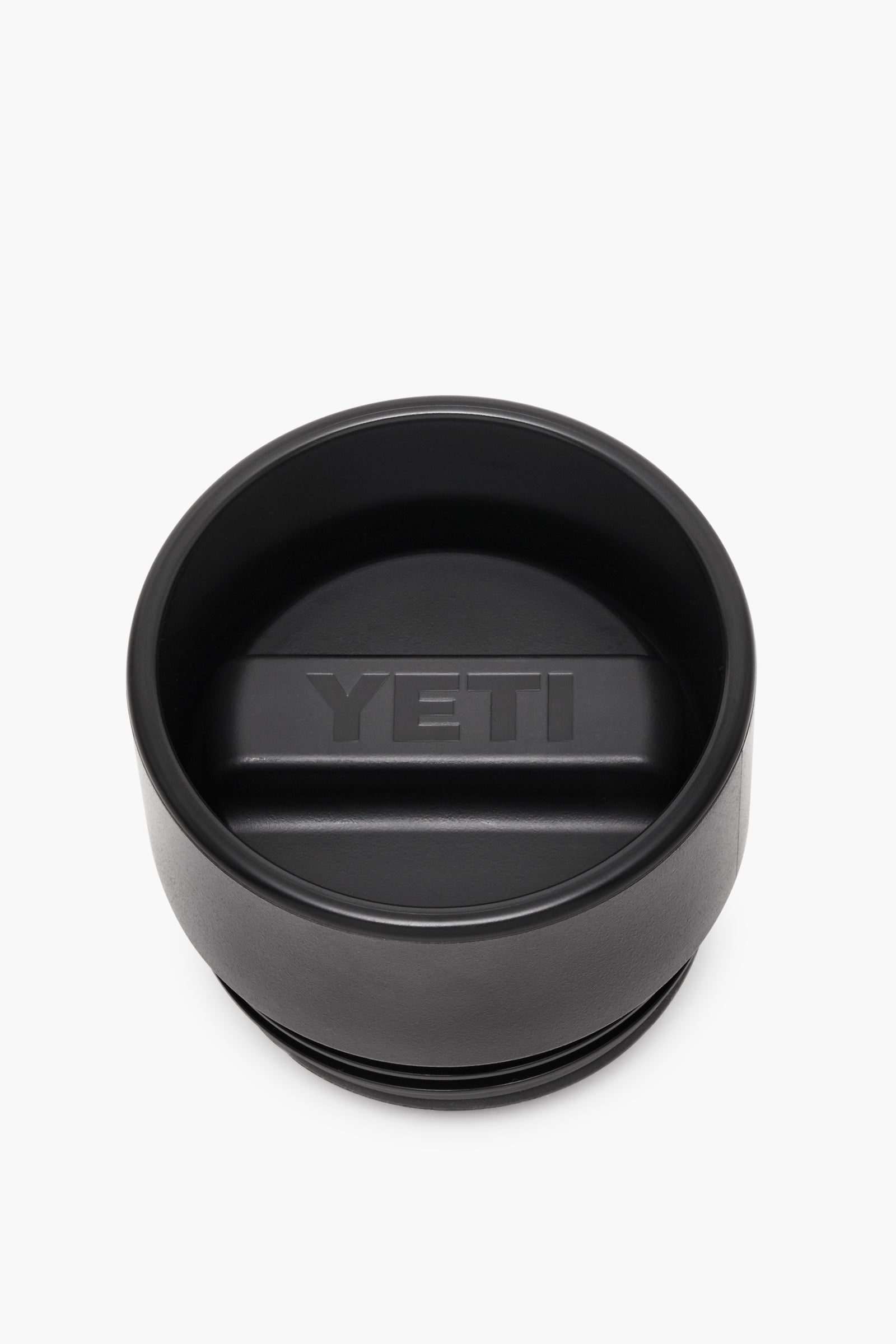 YETI black tumbler lid with a central raised handle and embossed logo, crafted as an insulated, leakproof cap for your Rambler bottle.