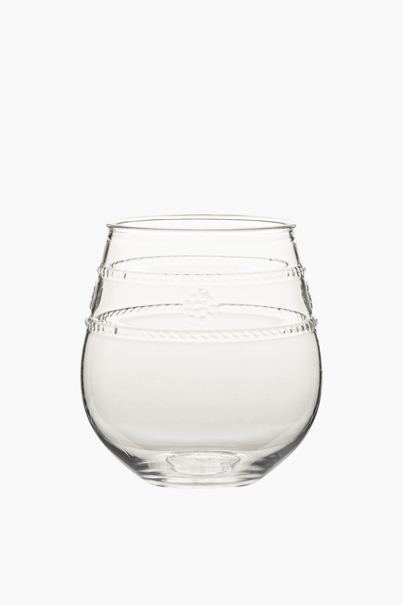 The Juliska clear, round stemless wine glass features a slightly tapered top and decorative horizontal etched lines around the upper half—perfect for outdoor dining.