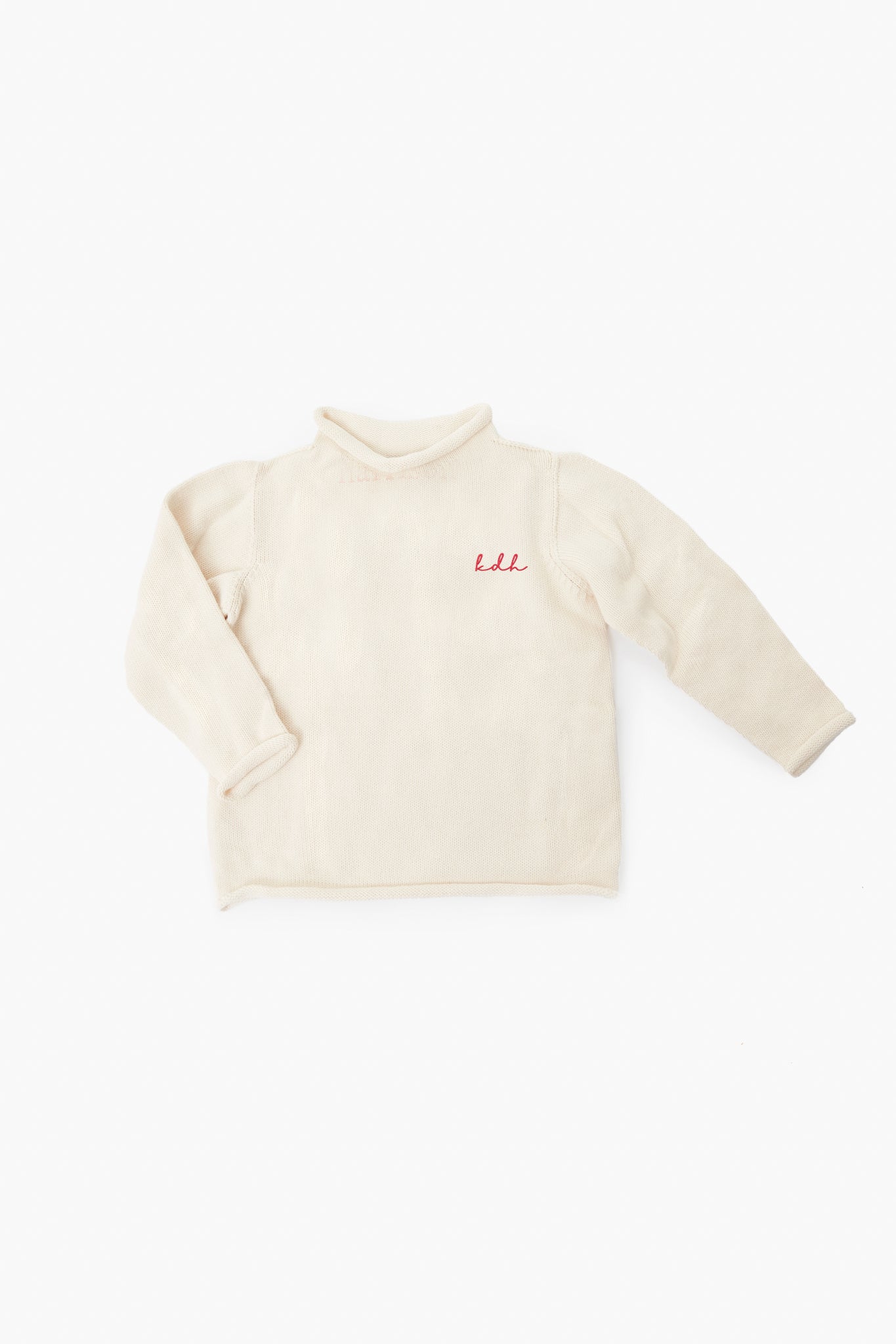 A Soft Idea beige long-sleeve fleece shirt with a high collar and red lali chest embroidery, inspired by the Natural Roll Neck Sweater and crafted as a cotton essential.