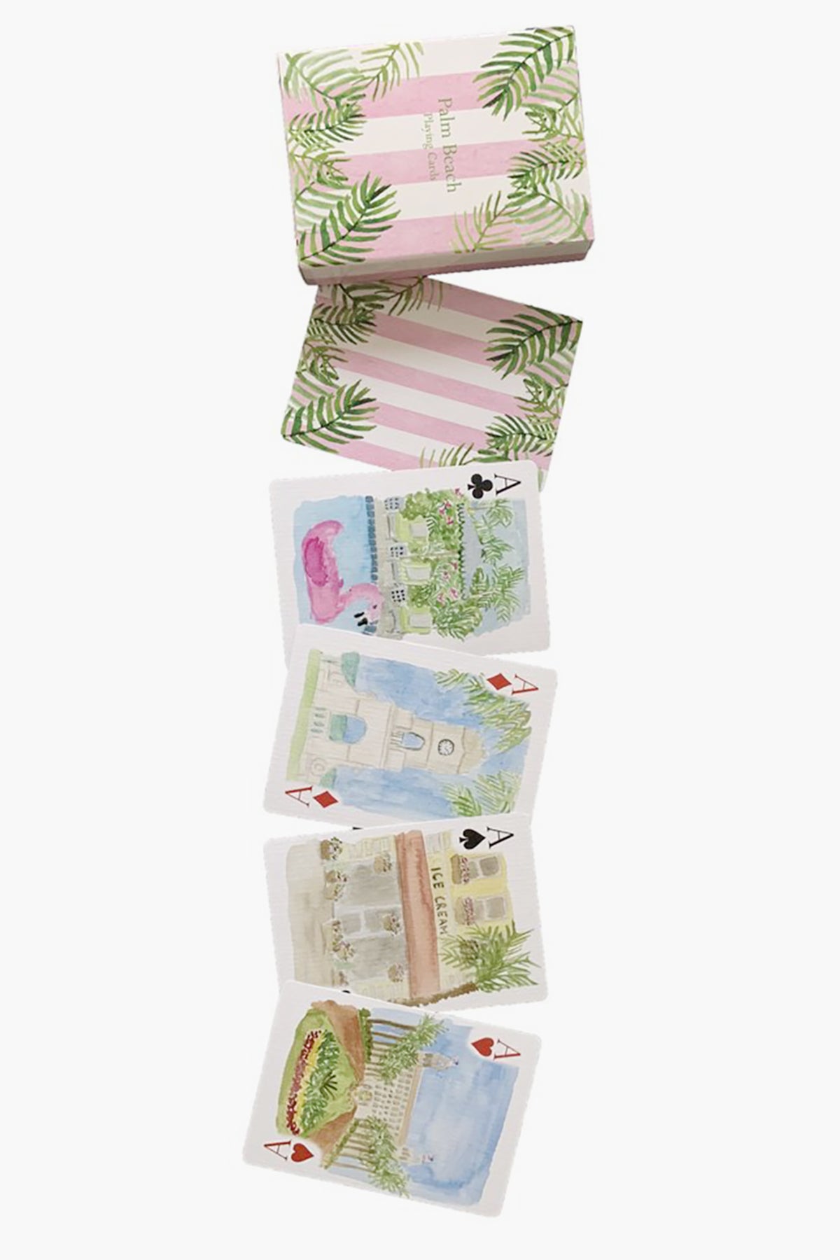 A LouLou Baker box with a pink and green leaf design sits above six Palm Beach playing cards, each with watercolor scenes or objects—making them perfect for unique gifts.