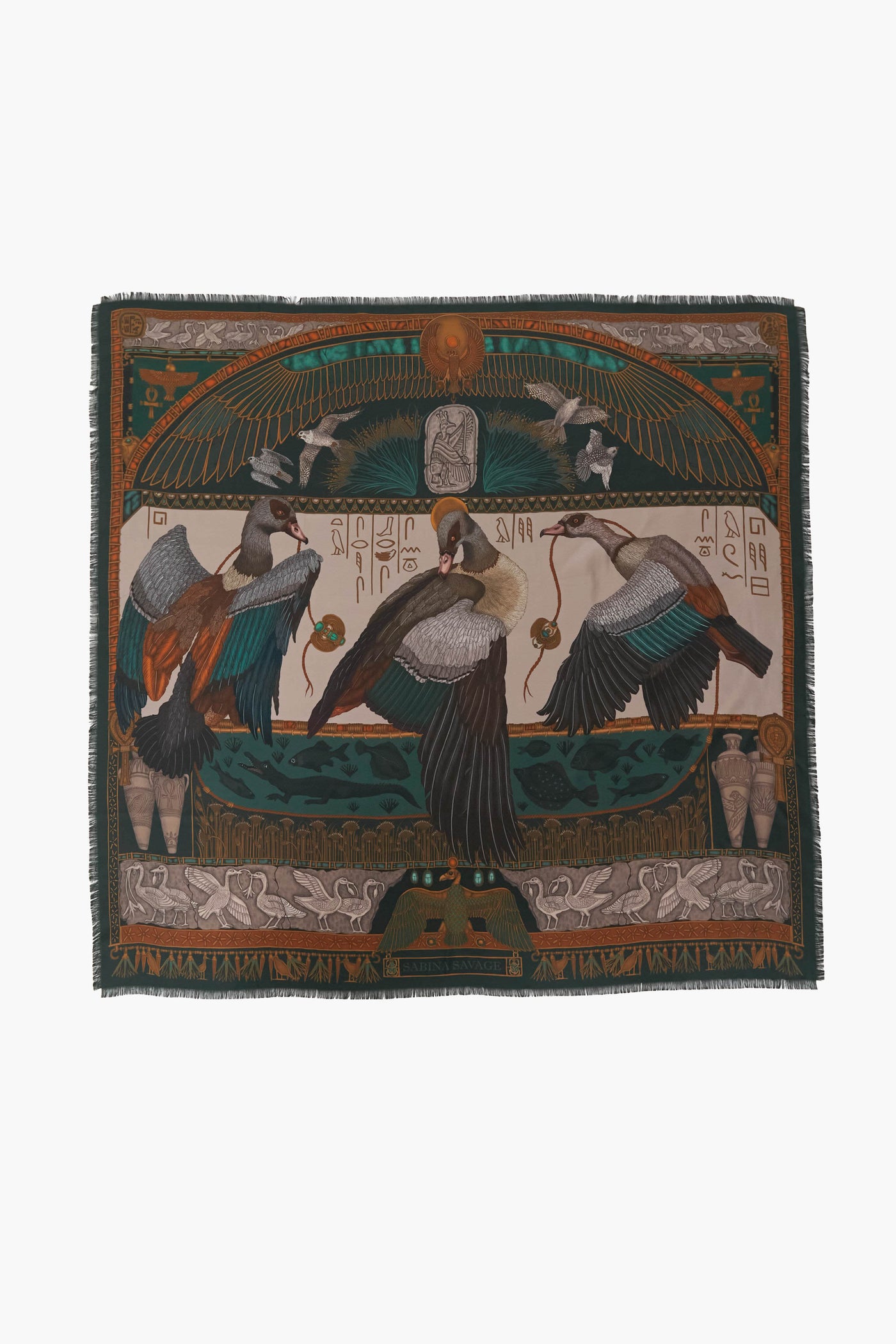 Rectangular silk scarf by Sabina Savage with an Egyptian motif, depicting birds, hieroglyphics, and ornate patterns in green, gold, and brown tones.