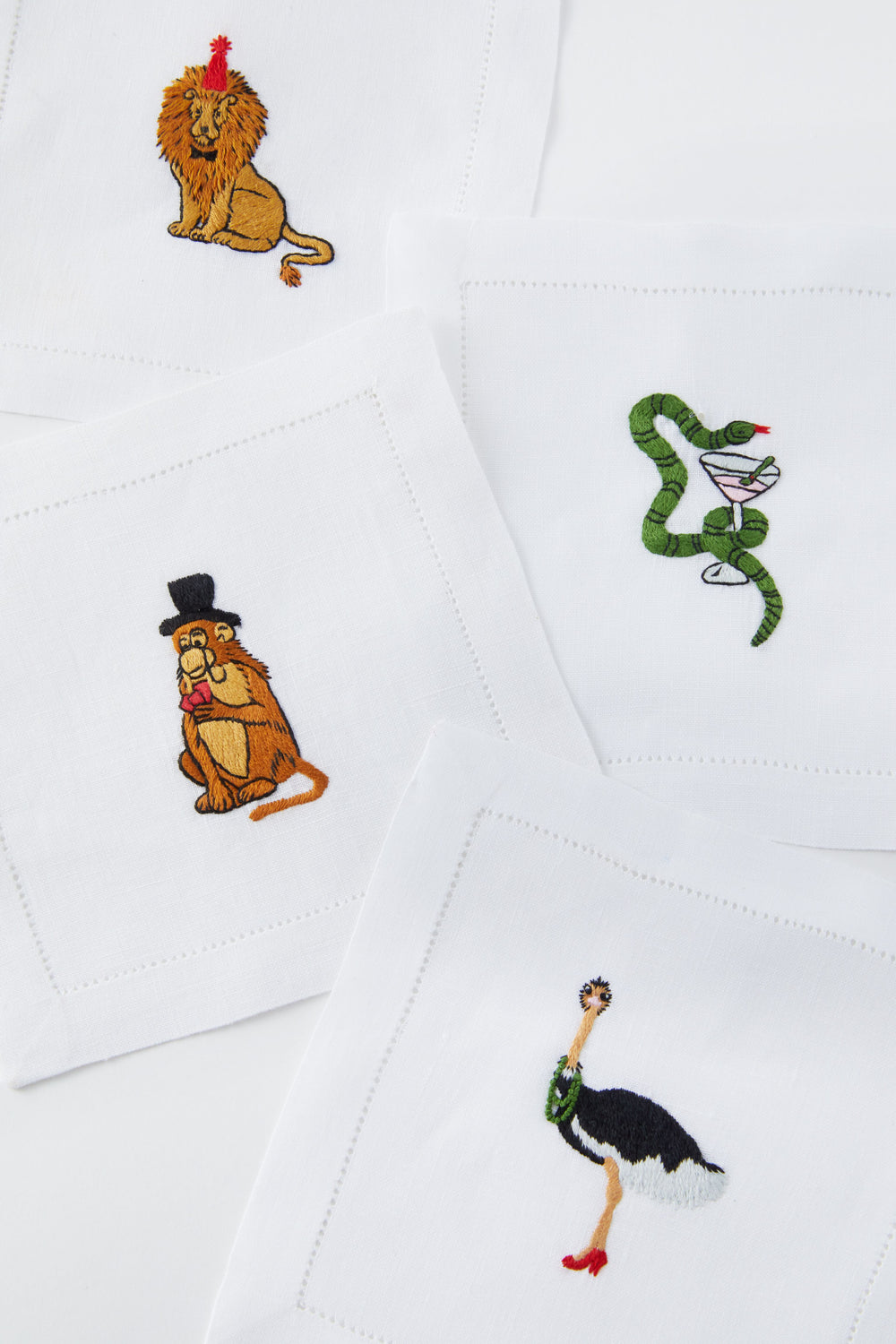 A set of linen napkins by Tuckernuck Home featuring charming animal motifs.