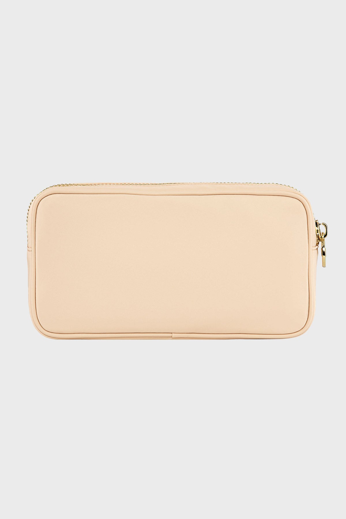 A Stoney Clover Lane rectangular beige zippered pouch with a smooth surface, perfect as a small makeup organizer or travel accessory.
