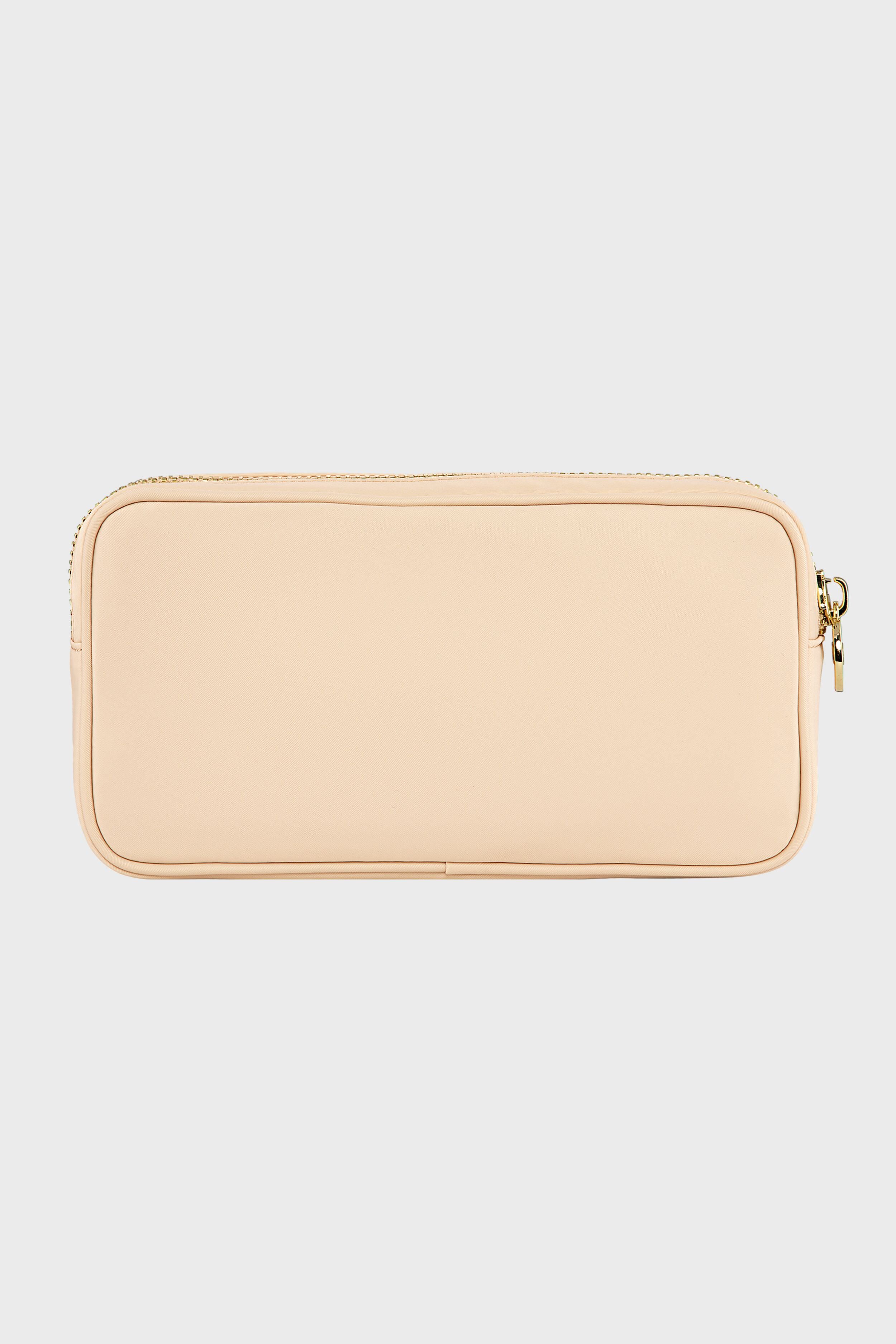 A Stoney Clover Lane rectangular beige zippered pouch with a smooth surface, perfect as a small makeup organizer or travel accessory.