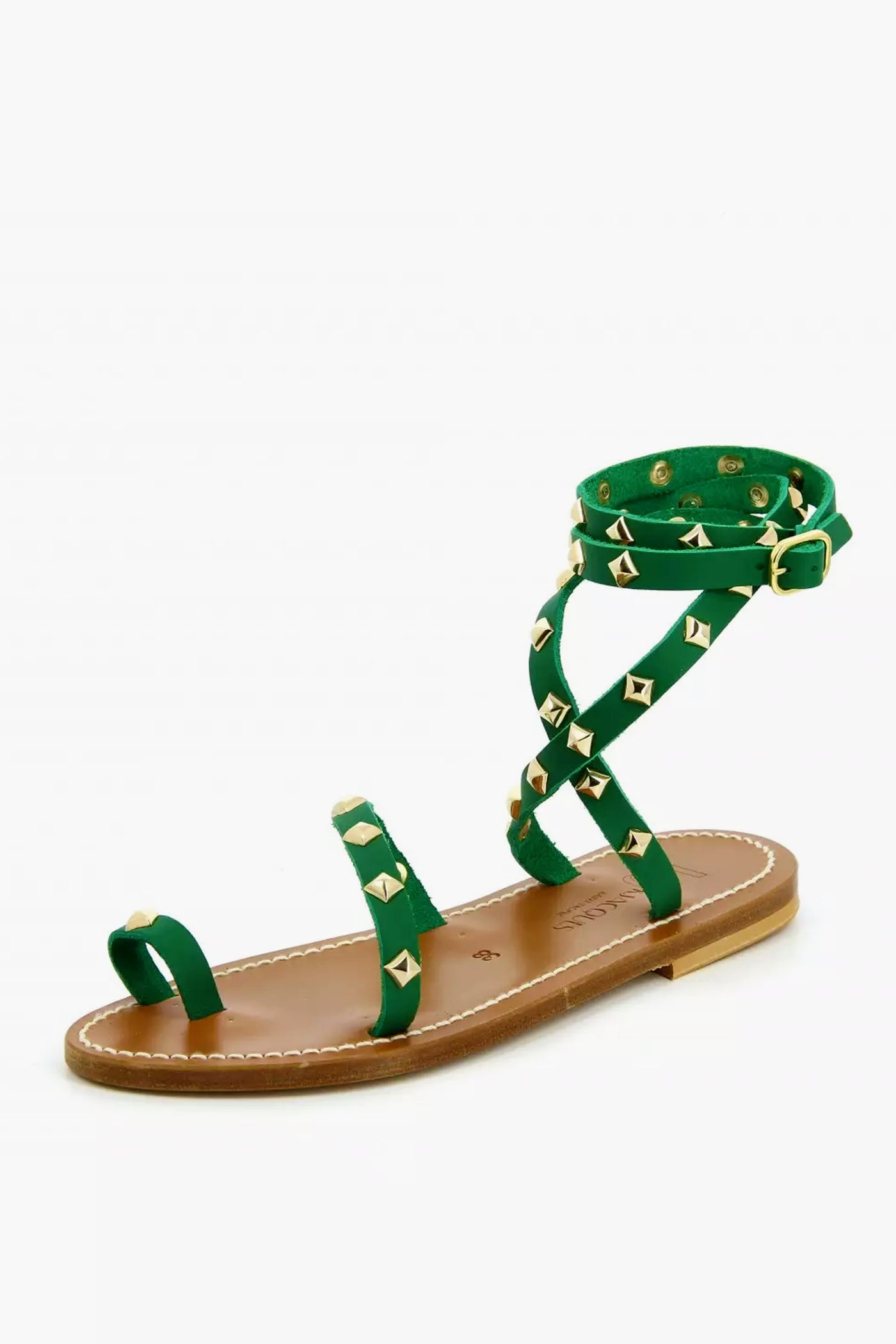 The K.Jacques green strappy sandal features gold square studs, an ankle buckle closure, and a brown sole, inspired by handmade leather sandals.
