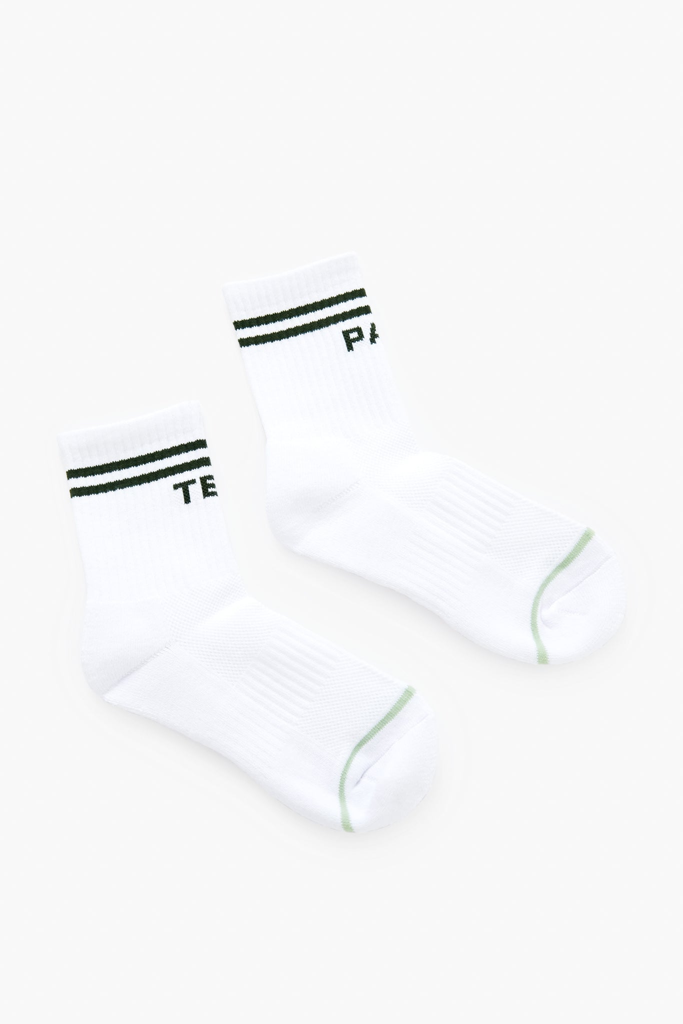 Tnuck Sport Par Tee Socks: Crew-length socks with white fabric, green toe accents, two green cuff stripes, and partial green text. Stylish and breathable for all-day comfort.