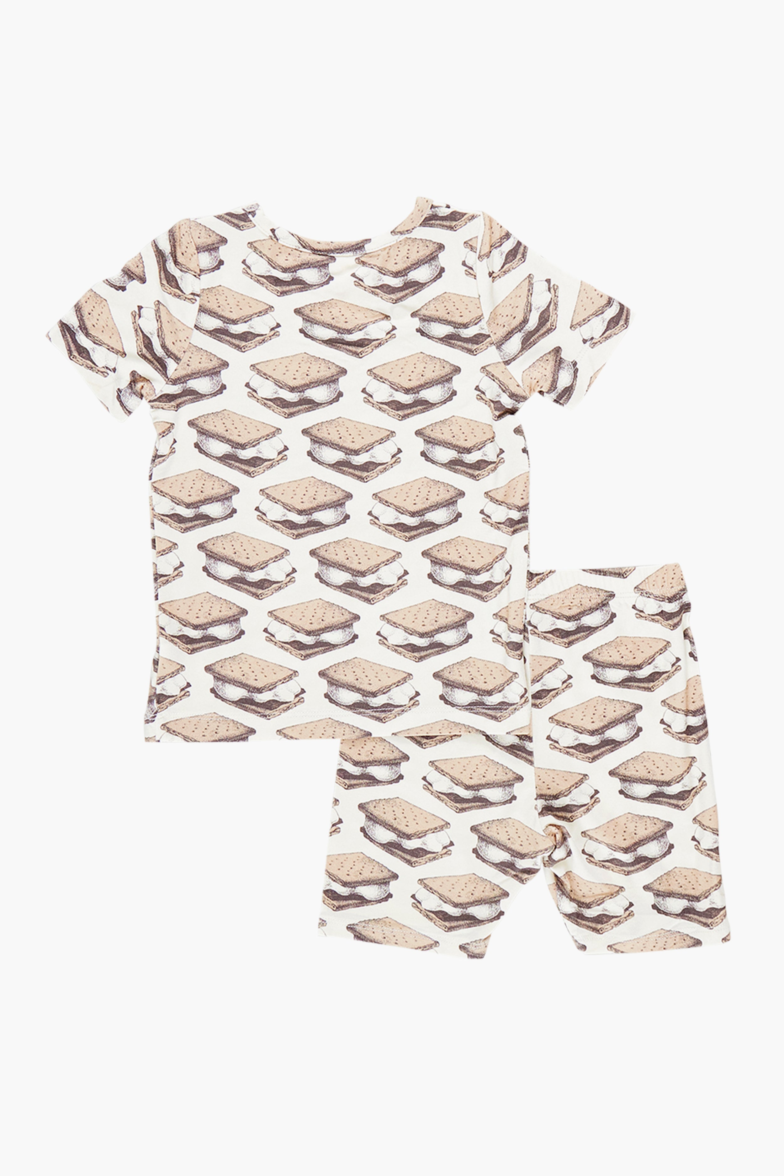 The Pink Chicken Smores Kids Bamboo PJ Set features an all-over s'mores print on a white shirt and shorts, displayed flat on a white surface.