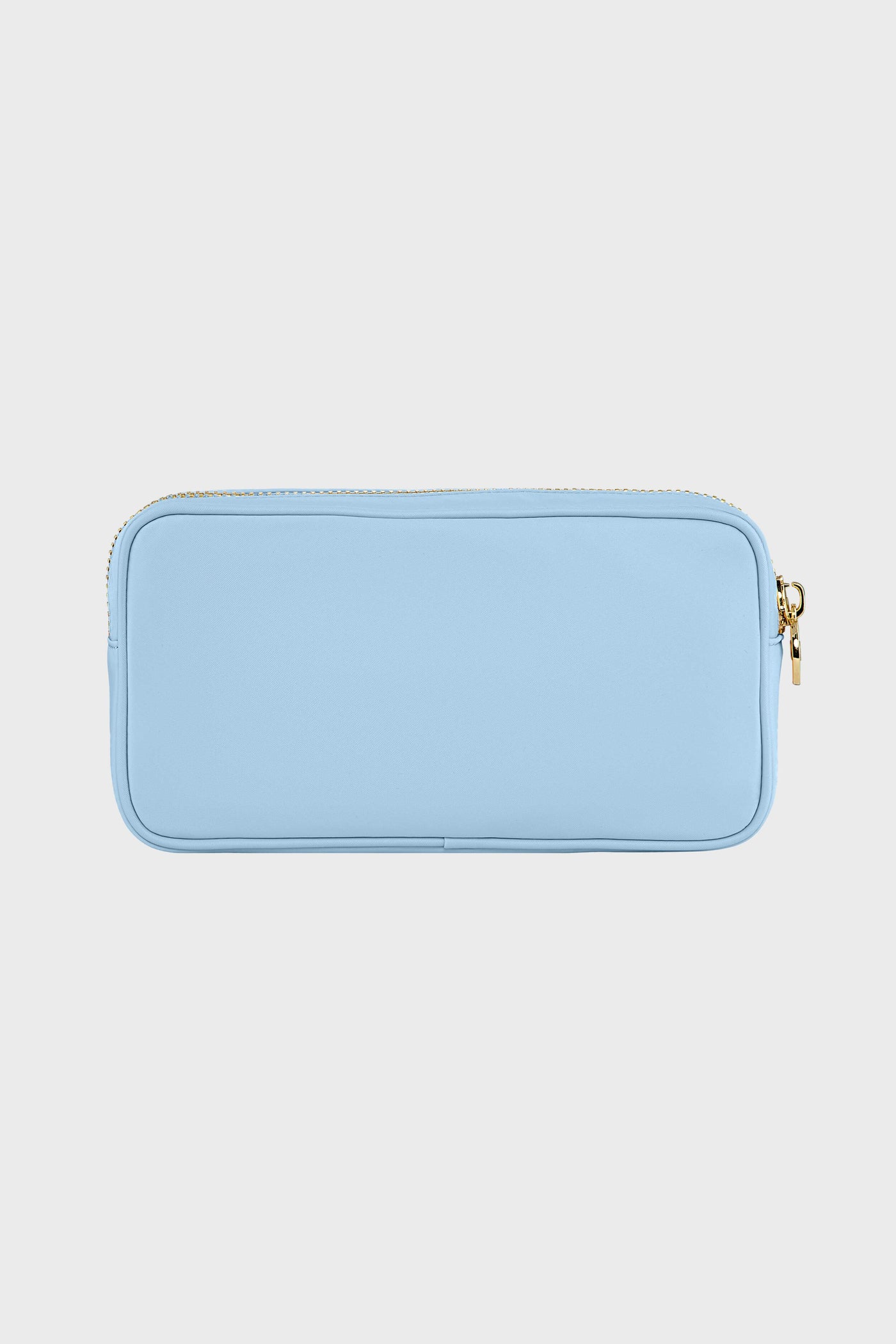 The Stoney Clover Lane rectangular light blue zippered pouch features a gold zipper and is perfect as a clear small makeup bag or travel accessory organizer.