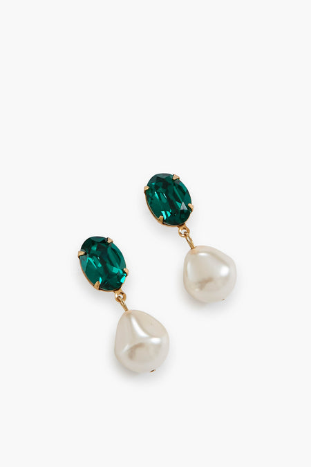 A pair of Jennifer Behr luxury handmade earrings with oval green gemstones atop irregular white pearls, set in gold-tone metal.