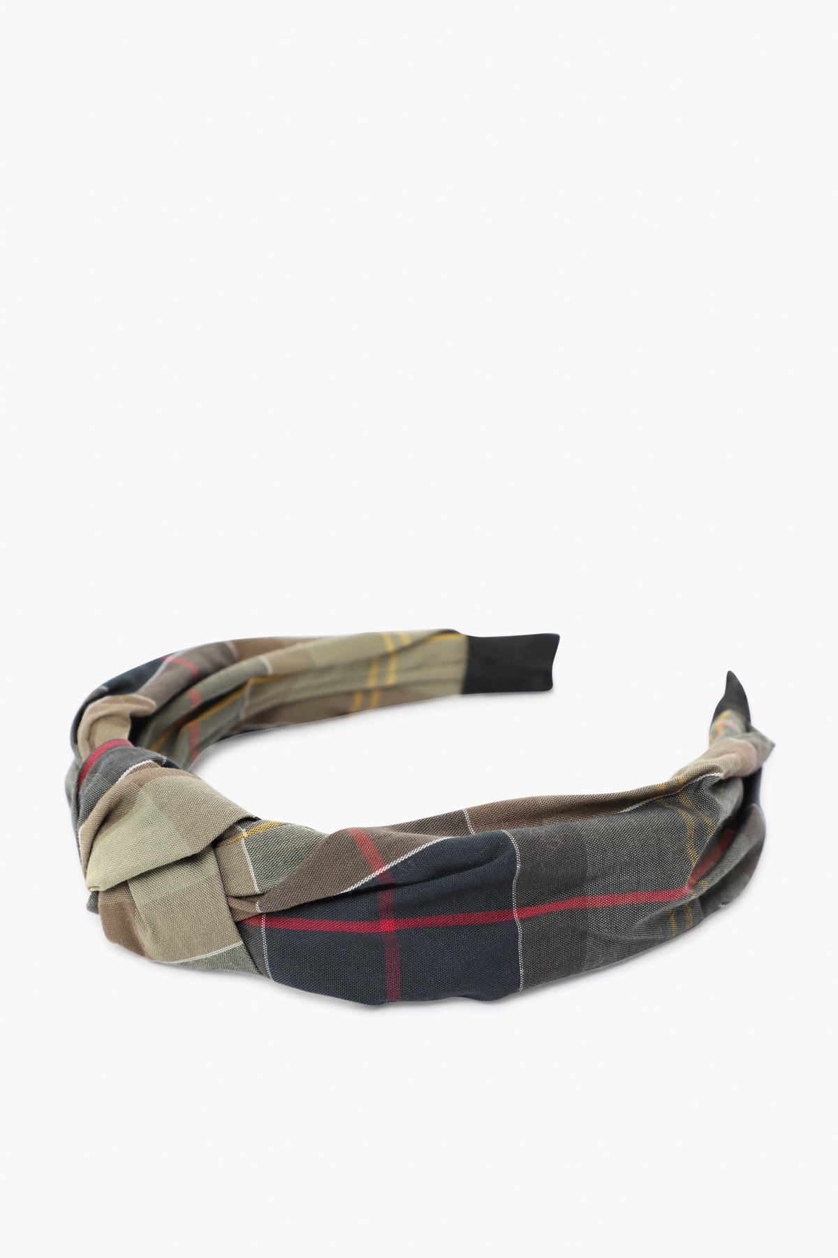 This Barbour fabric headband, featuring a twisted knot and multicolored plaid pattern, is a classic tartan accessory that adds a stylish touch to any outfit.