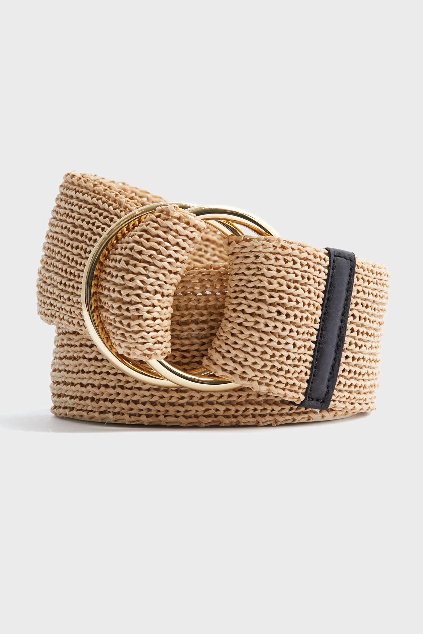 The B-Low the Belt wide woven straw belt in beige features a double gold circular buckle and a black faux leather accent, perfect for adding bohemian style to your look.