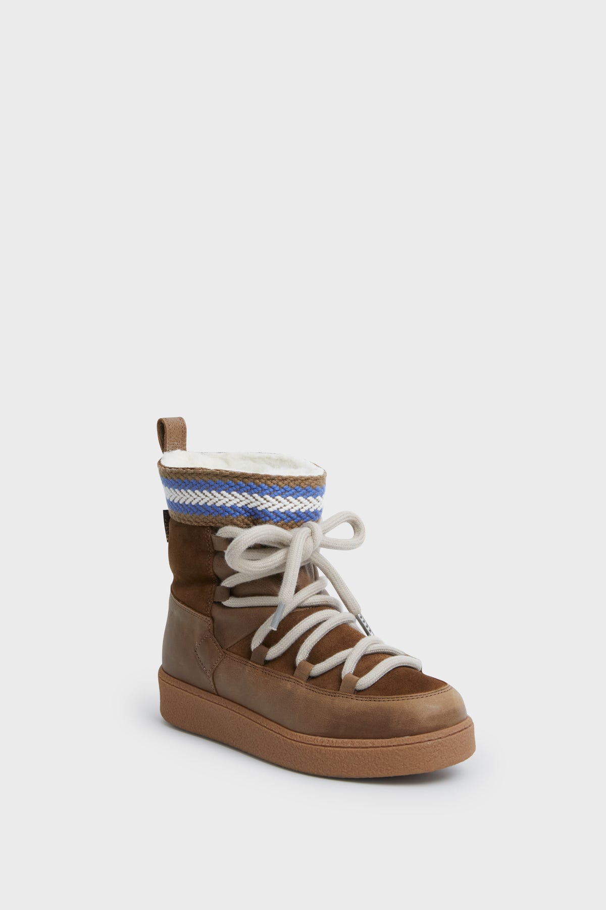 A Penelope Chilvers brown suede leather high-top sneaker with white laces, tan sole, back pull tab, and blue-white woven ankle detail—blending cozy wool boot comfort with modern style.