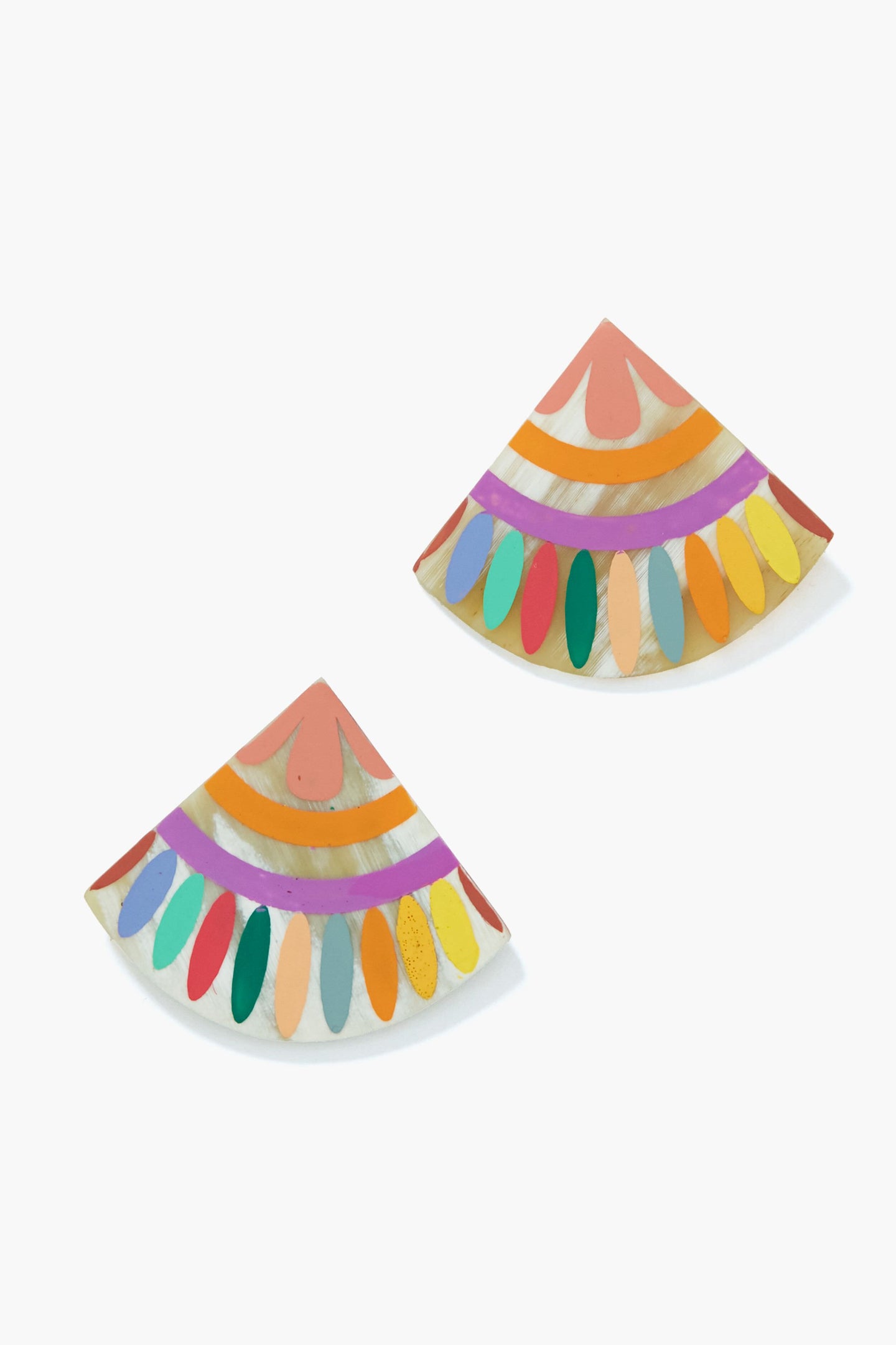 Sunshine Tienda’s lightweight stud earrings, crafted from semi-circular buffalo horn, feature hand-painted patterns in pink, gold, and orange—adding a vibrant touch to any look.