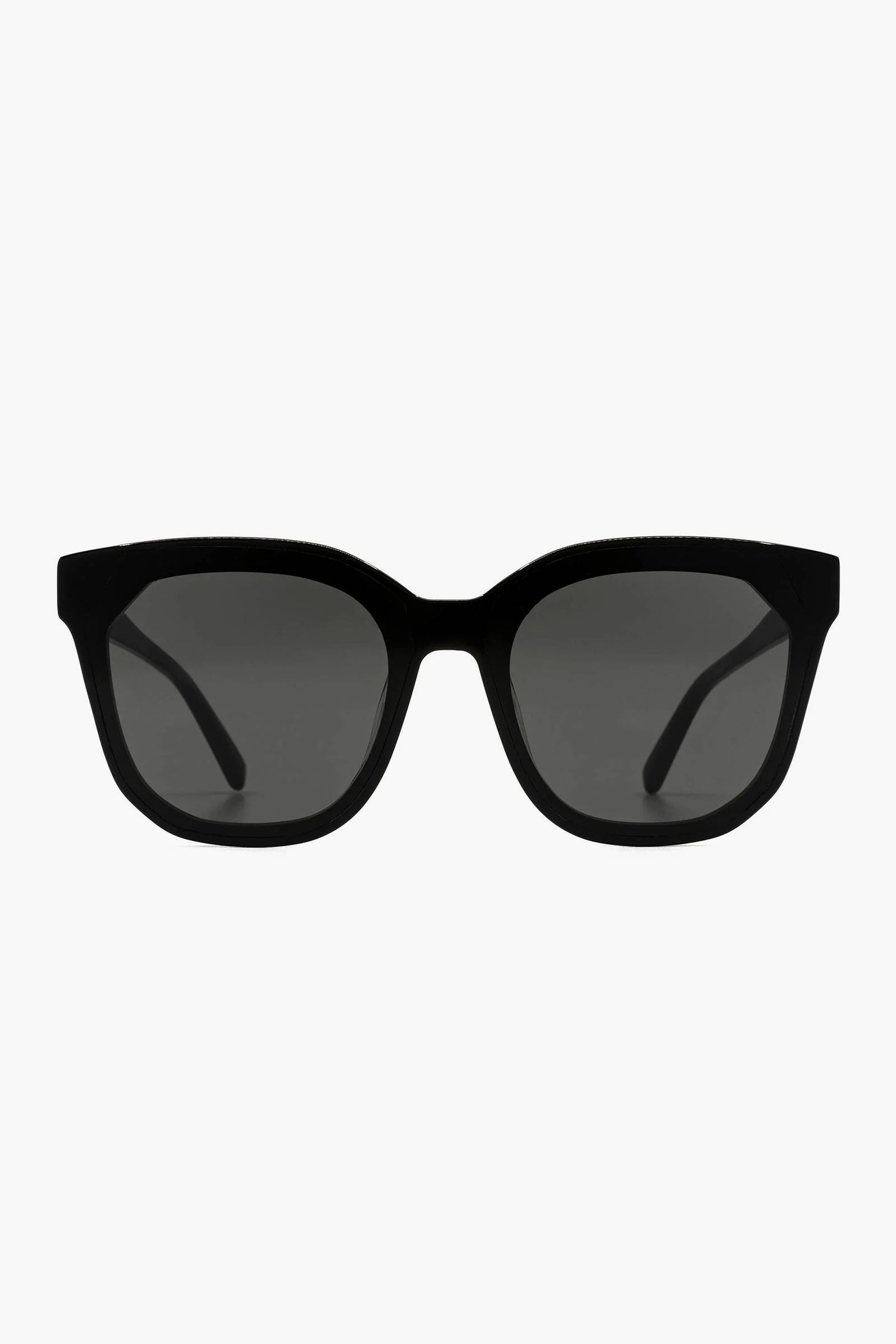 DIFF Eyewear’s black rectangular oversized sunglasses feature thick frames, dark tinted lenses, and UVA/UVB protection.