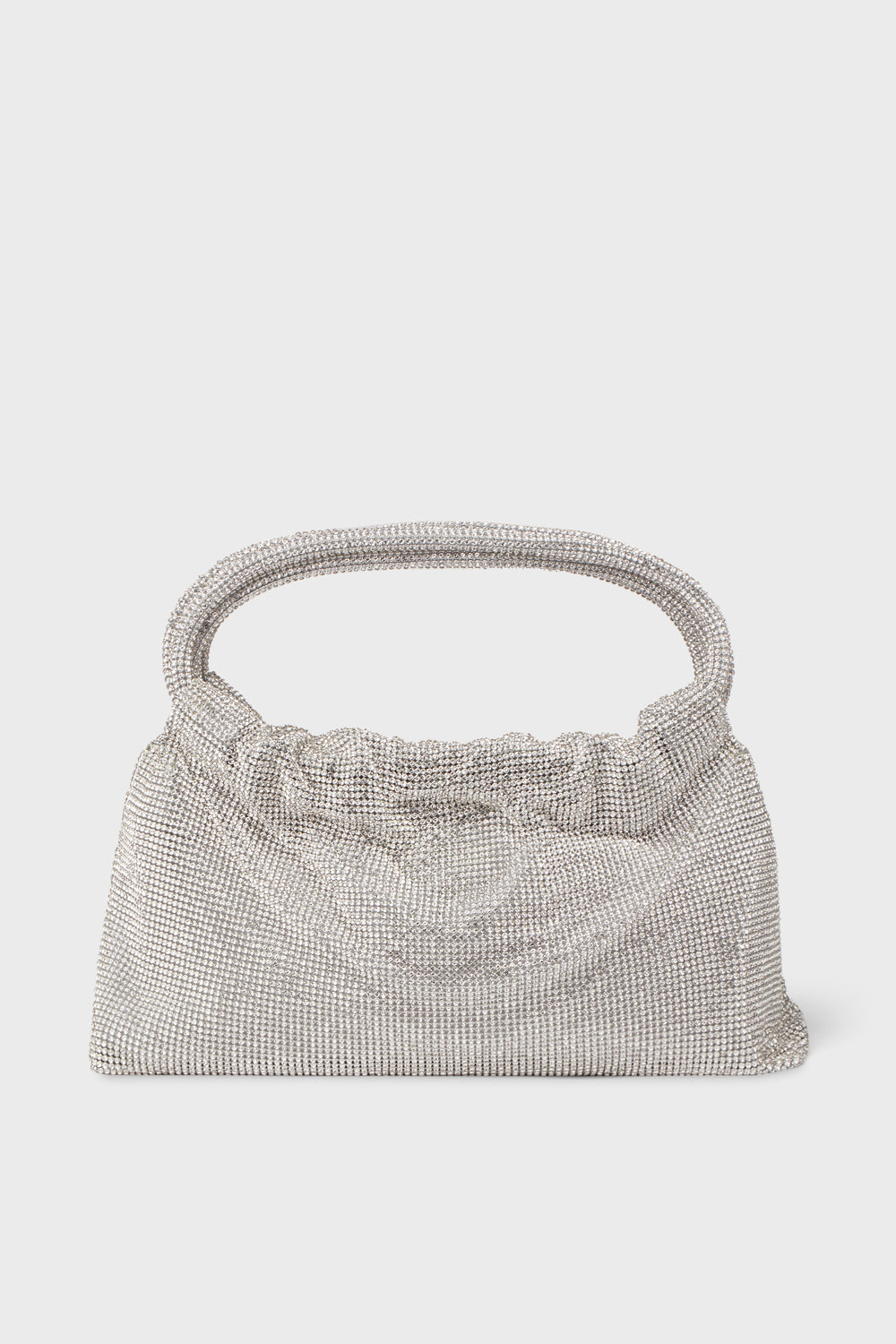 A SIMKHAI silver mesh designer evening bag with a gathered top and single rounded handle, perfect for pairing with luxury ready-to-wear ensembles.