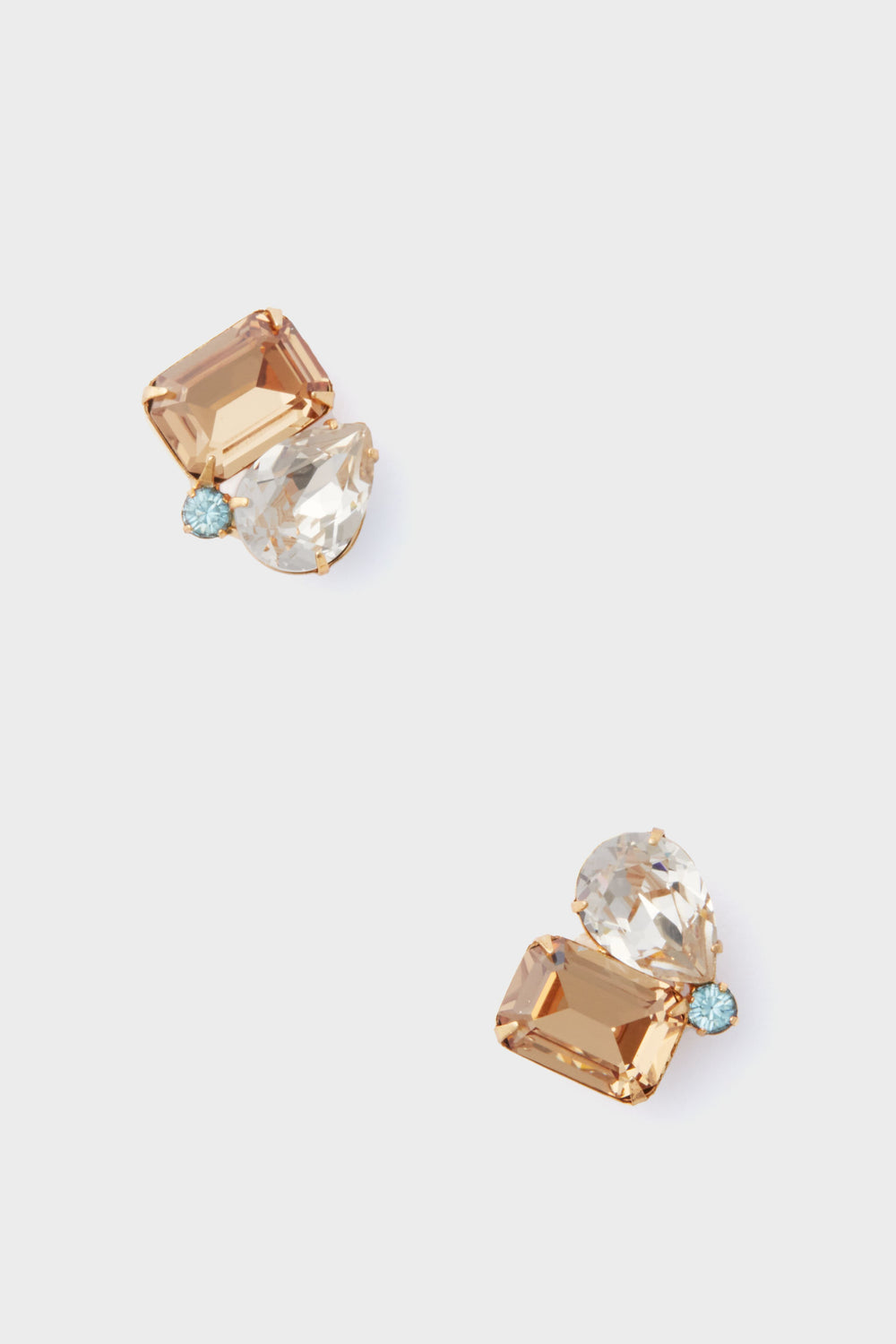 A pair of Jennifer Behr gold-plated Austrian crystal earrings with a rectangular amber stone, a pear-shaped clear stone, and a small round blue stone.