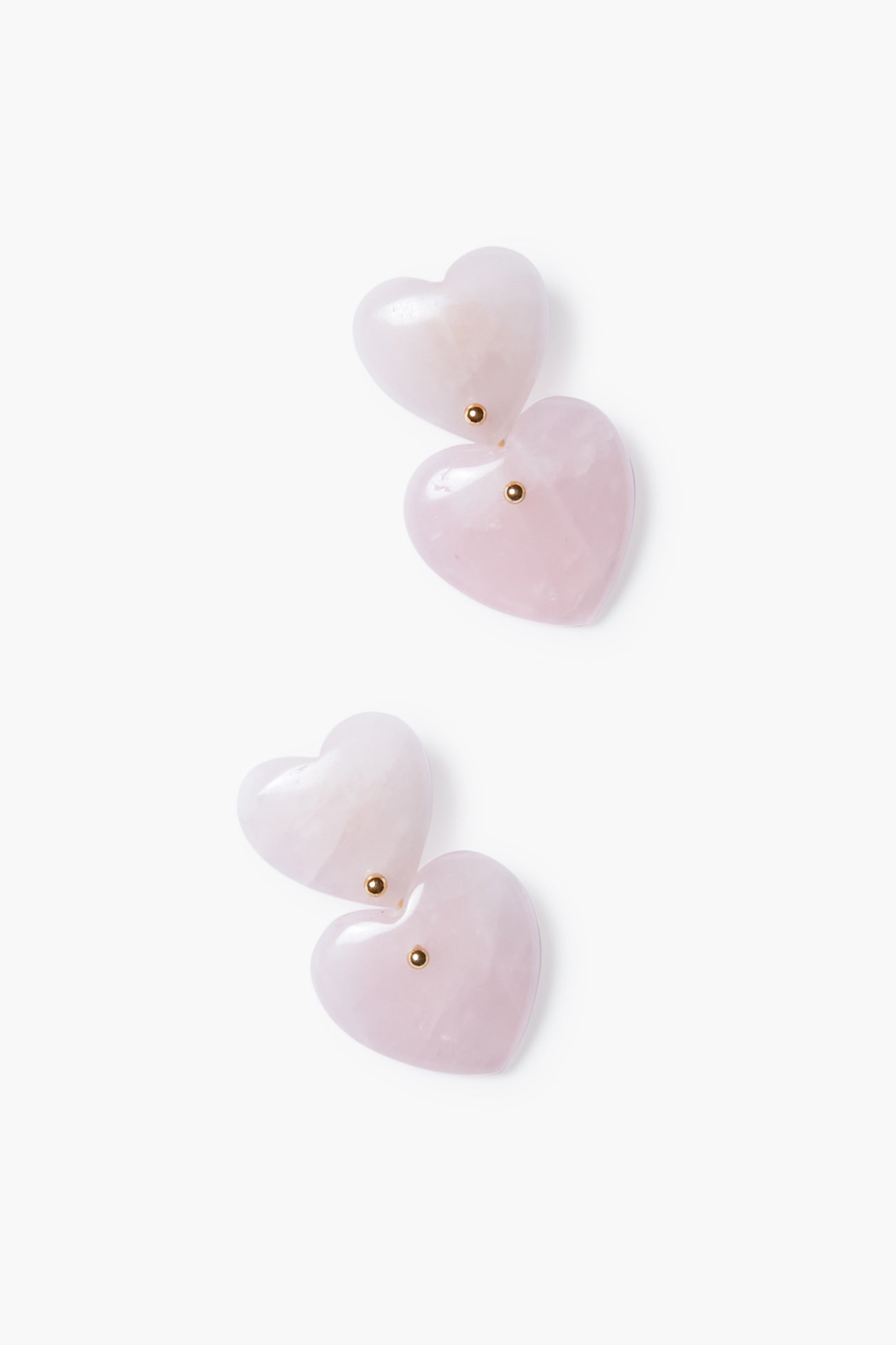 Tuckernuck Jewelry offers gold-plated heart earrings with pink heart-shaped stones and small gold studs, elegantly designed with layered hearts.