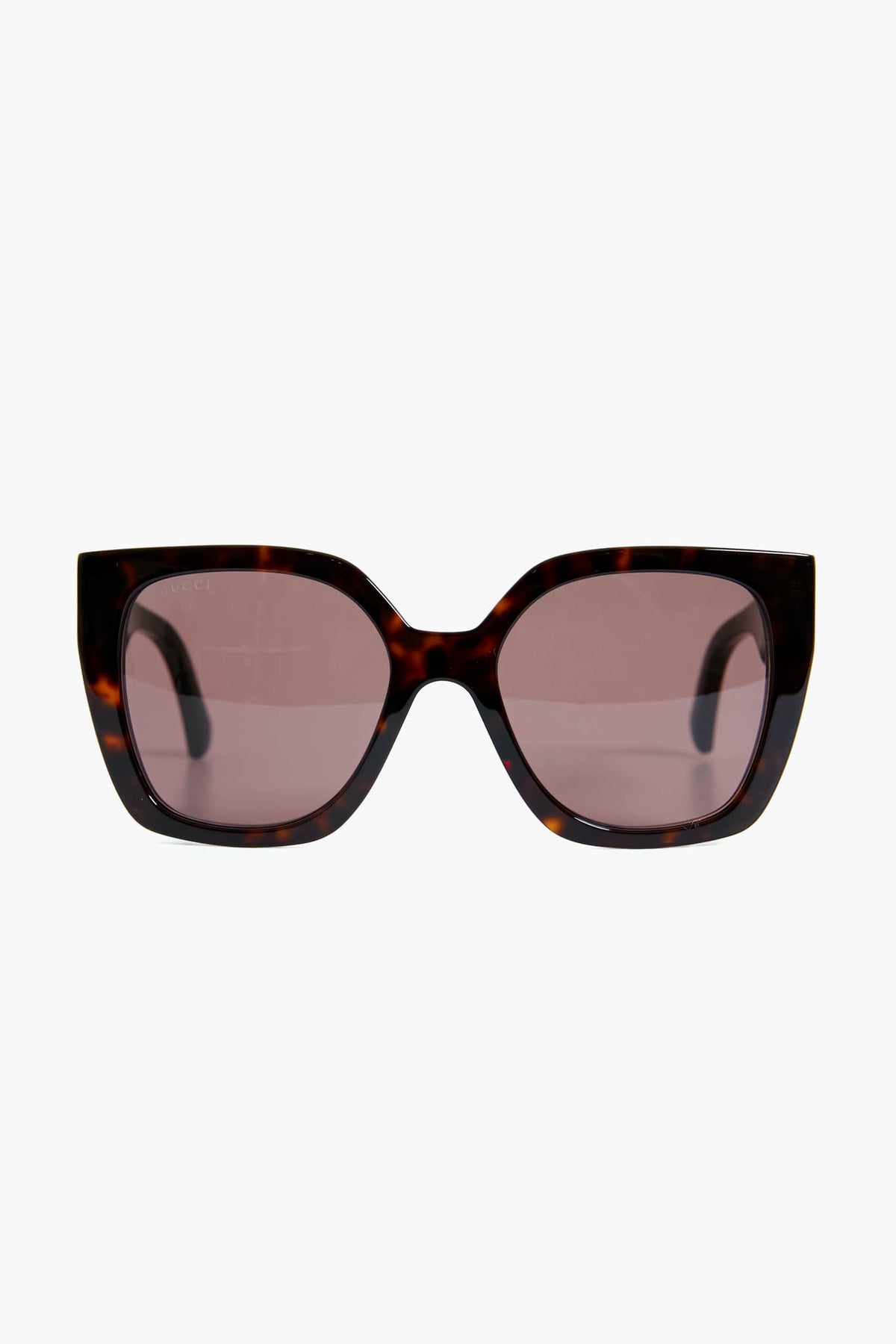 Gucci rectangular tortoiseshell sunglasses featuring thick frames and light brown-tinted lenses, designed in an oversized square style.