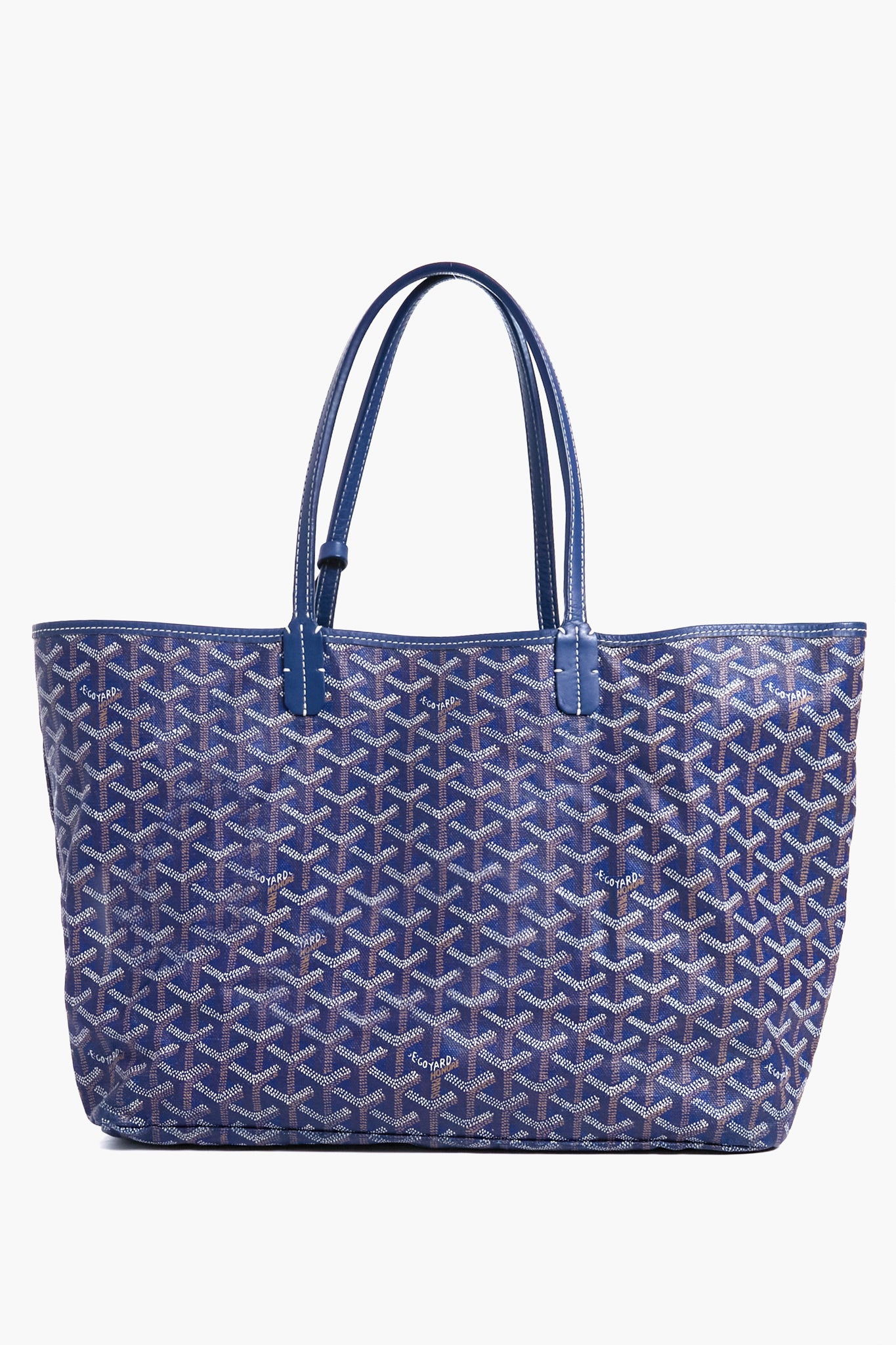 A blue Tuckernuck Archive Collection Saint Louis PM Tote Bag featuring an all-over geometric pattern, two handles, and signature Goyardine-style canvas.