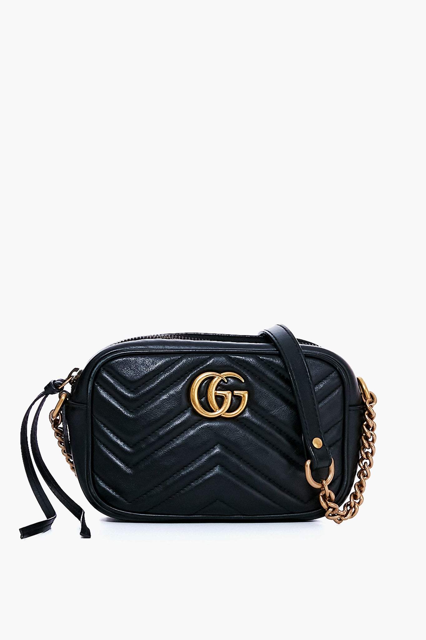 A black mini crossbody with chevron stitching, gold chain strap, and gold-tone logo on the front—discover this classic from the Tuckernuck Archive Collection in our selection of pre-owned luxury bags.