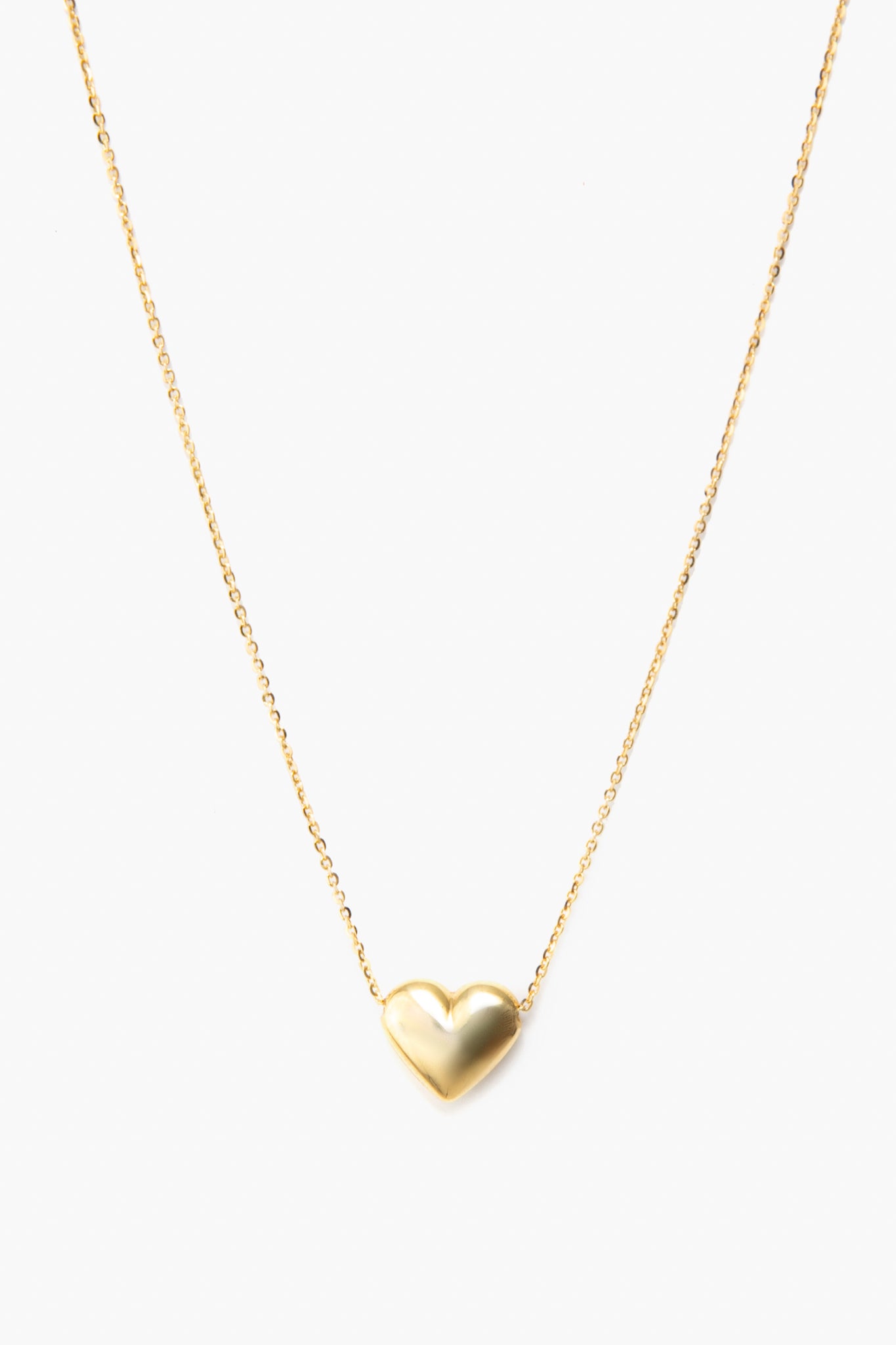 The Tuckernuck Fine Jewelry 14K Yellow Gold Necklace features a small, smooth heart charm centered elegantly on a fine gold chain.