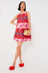 A woman in a Tuckernuck floral print mini dress.