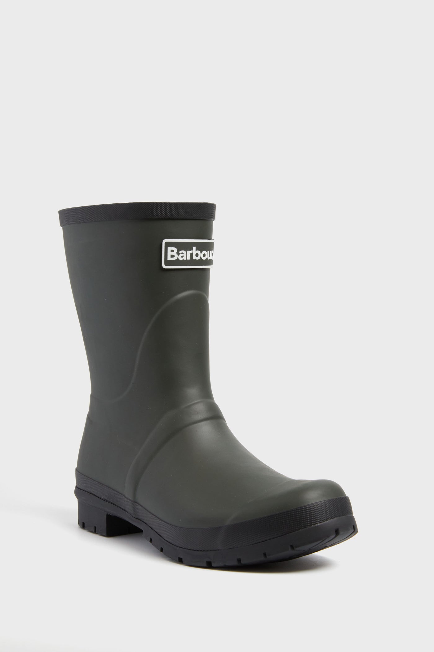 A single black Barbour wellington boot with a chunky sole and the Barbour logo on the front, ideal as waterproof outdoor footwear.