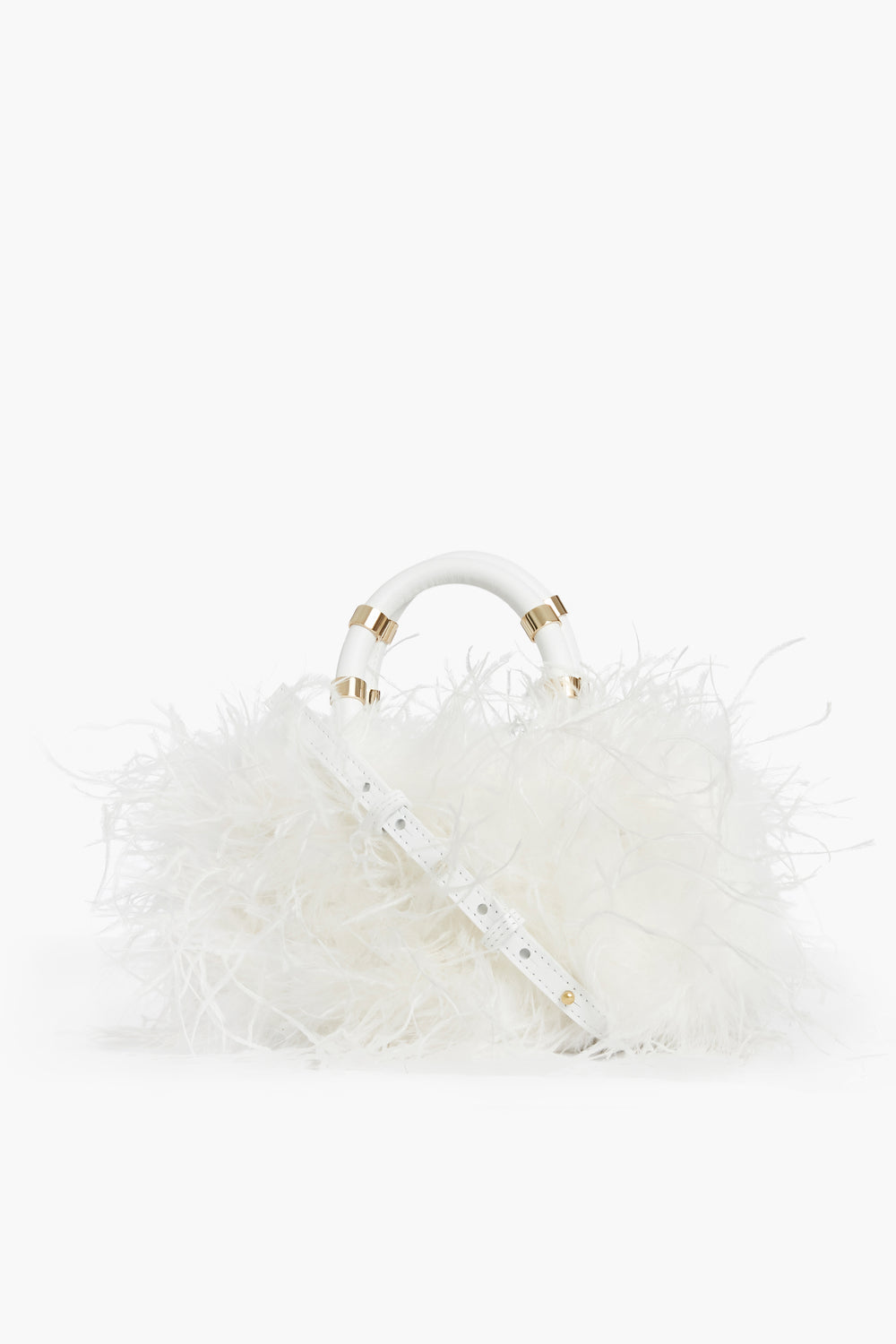 The J.LOWERY white ostrich feather handbag features a fluffy feather-like exterior, gold accents, and a detachable strap. This handmade leather crossbody bag is crafted in NYC.