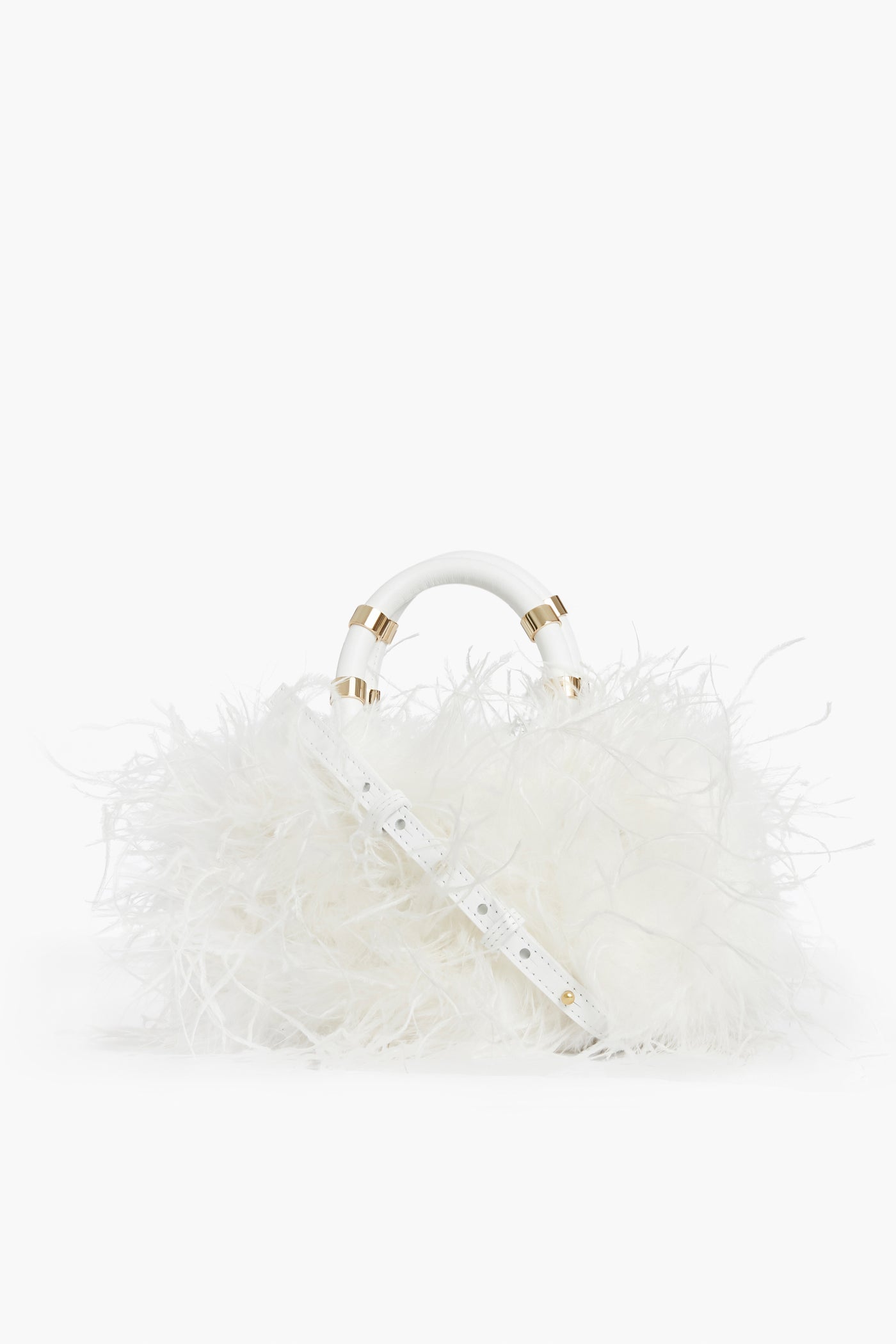 The J.LOWERY white ostrich feather handbag features a fluffy feather-like exterior, gold accents, and a detachable strap. This handmade leather crossbody bag is crafted in NYC.