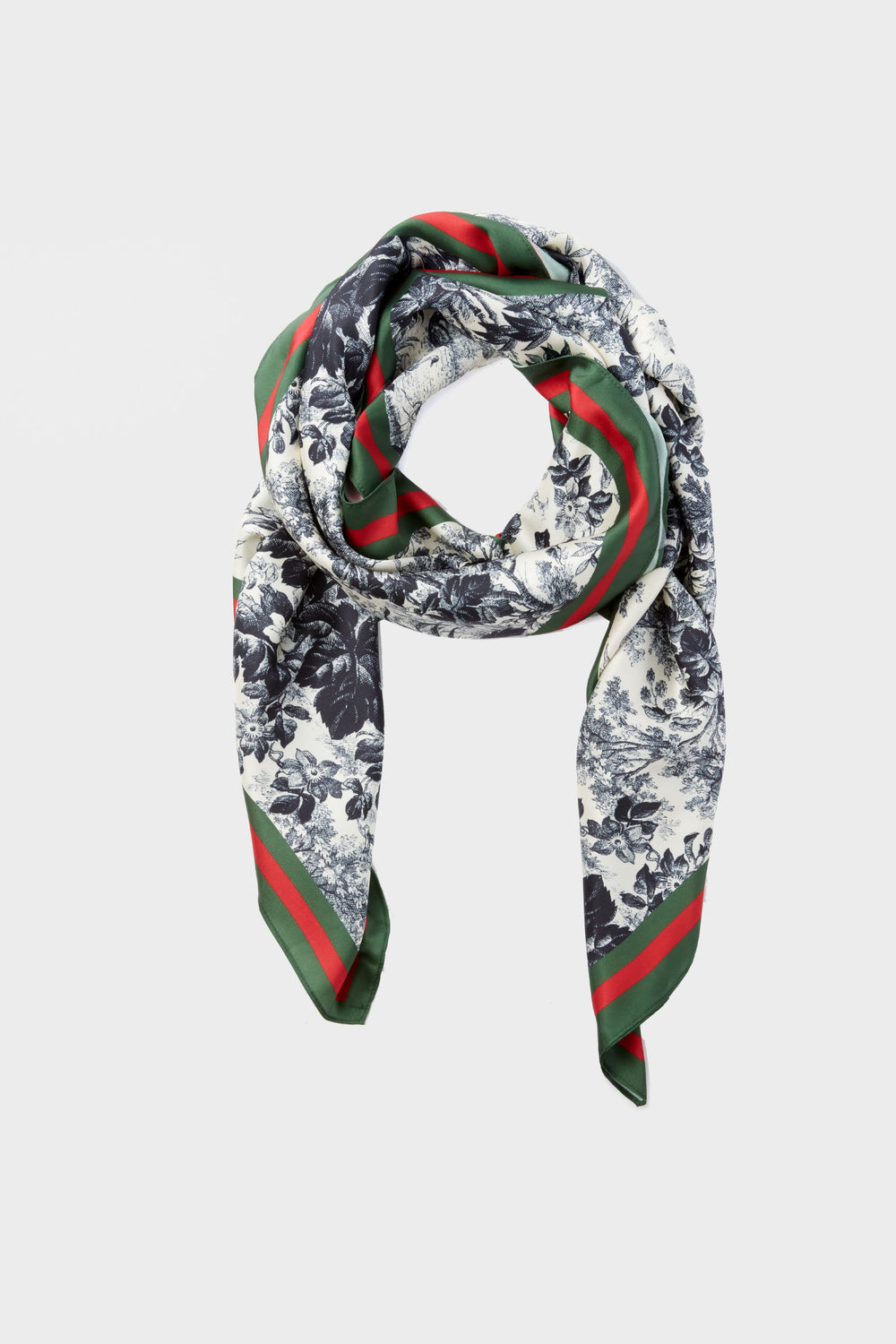 The Tuckernuck Accessories Silk Cypress Toile Scarf features a timeless black and white floral print with striking green and red striped borders, making it an elegant classic accessory.