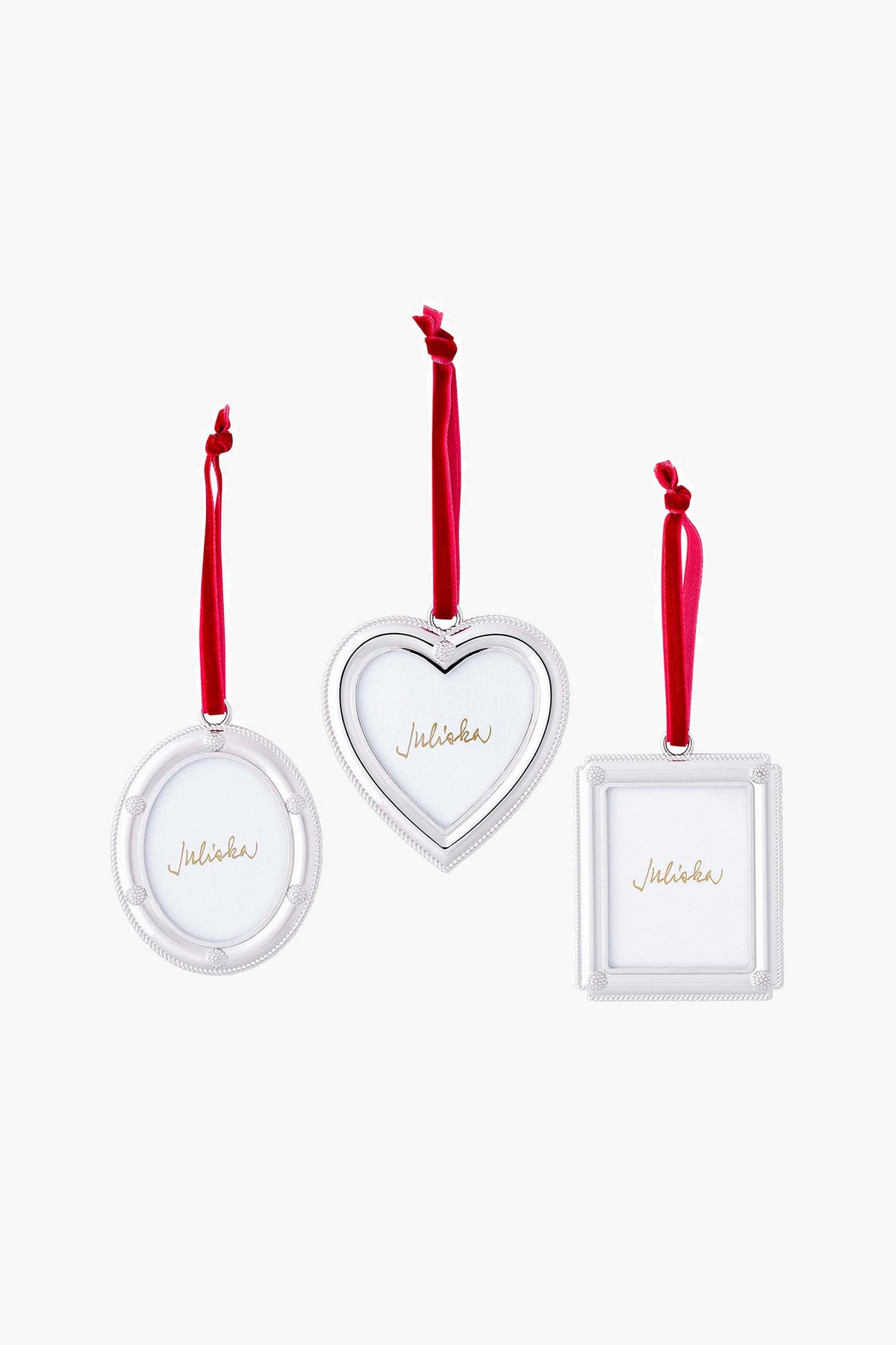 Three Juliska silver picture-frame ornaments—round, heart-shaped, and square—hang from red ribbons, ideal for festive holiday décor or as a thoughtful hostess gift.