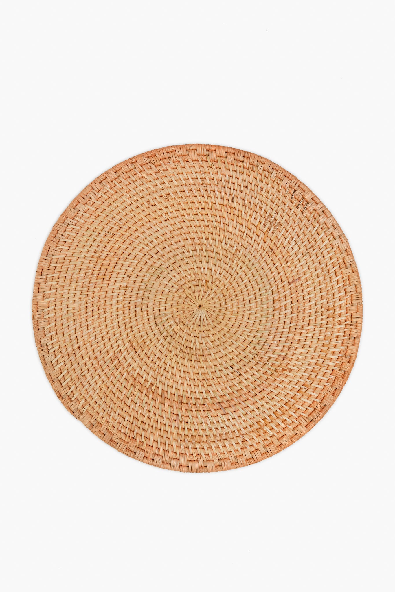 The Caton's Wharf round placemat, made from woven rattan in a natural tan shade, brings organic charm to your table.
