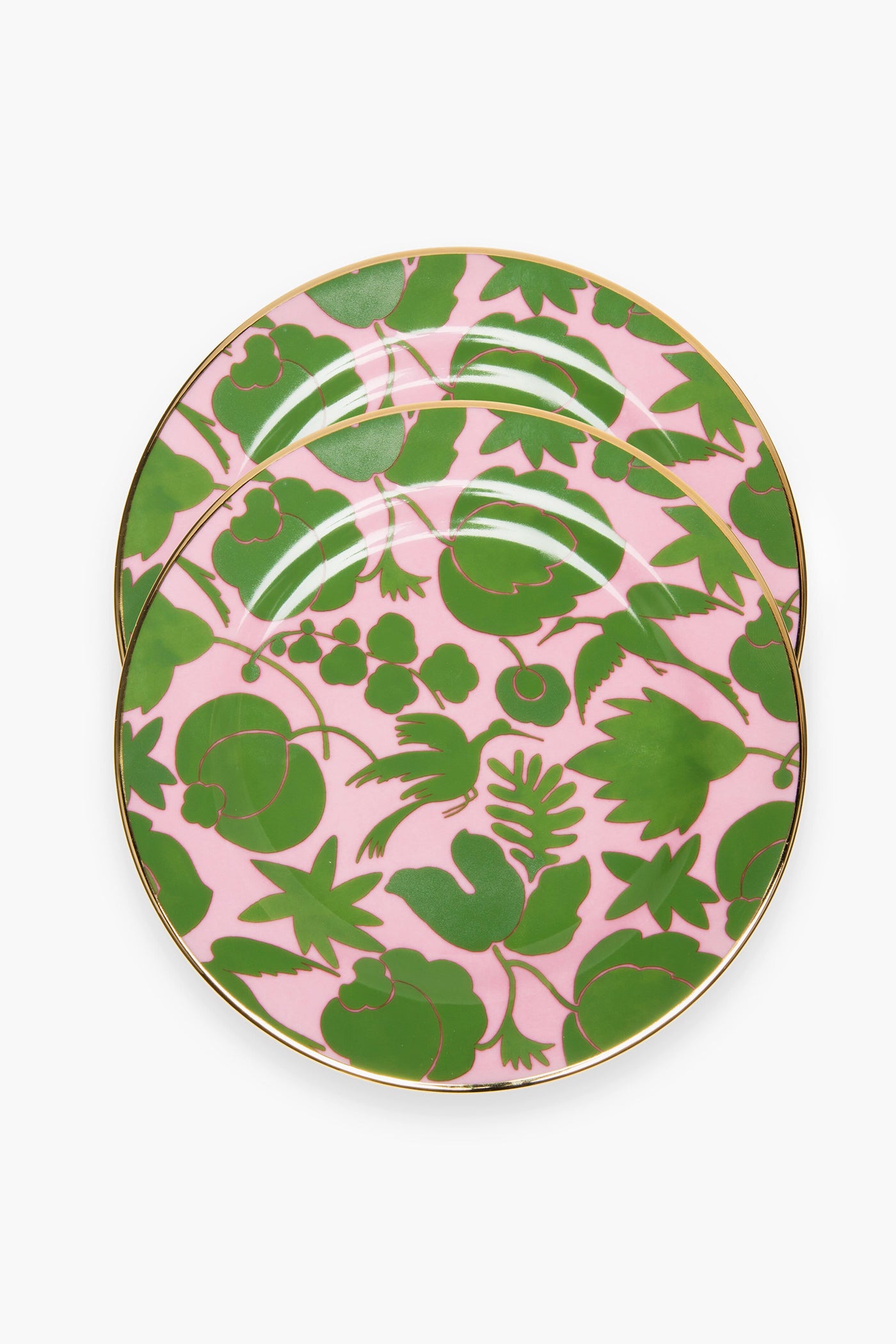 Two round La DoubleJ Rosa and Verde Dessert Plates, crafted in Italy from fine porcelain with green botanical designs and a gold rim, overlap on a white surface.