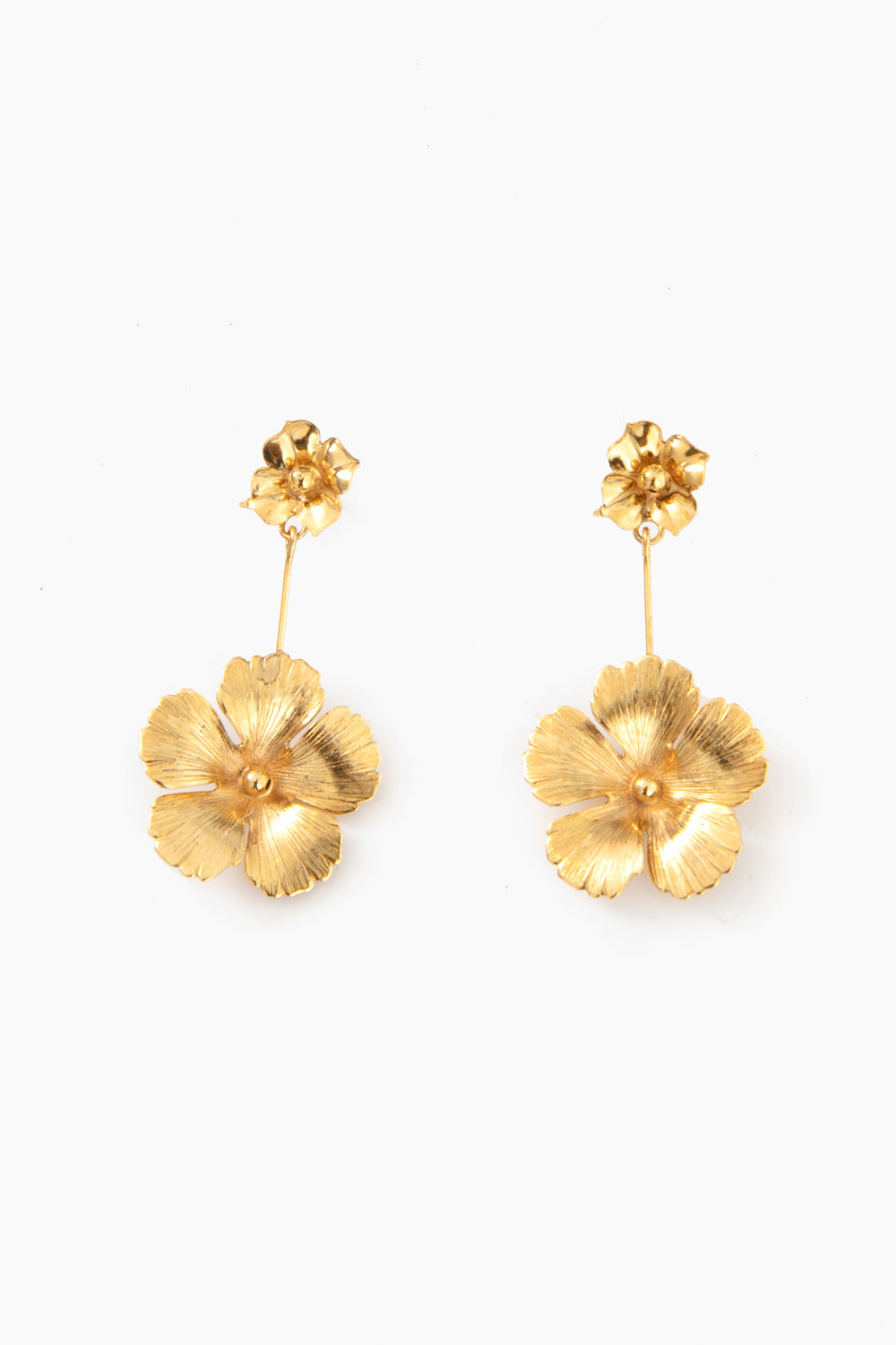 Jennifer Behr's luxury gold floral earrings are handmade in New York, featuring a small flower at the post and a larger flower dangling below.