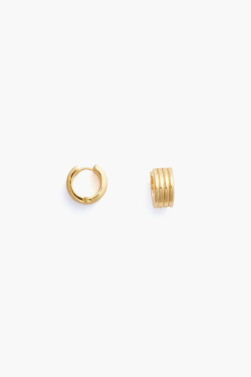 Two small gold hoops from Tuckernuck Jewelry, one open and one closed, feature a ridged, segmented design—perfect as stackable earrings or worn as Gold Infinity Huggie Earrings.