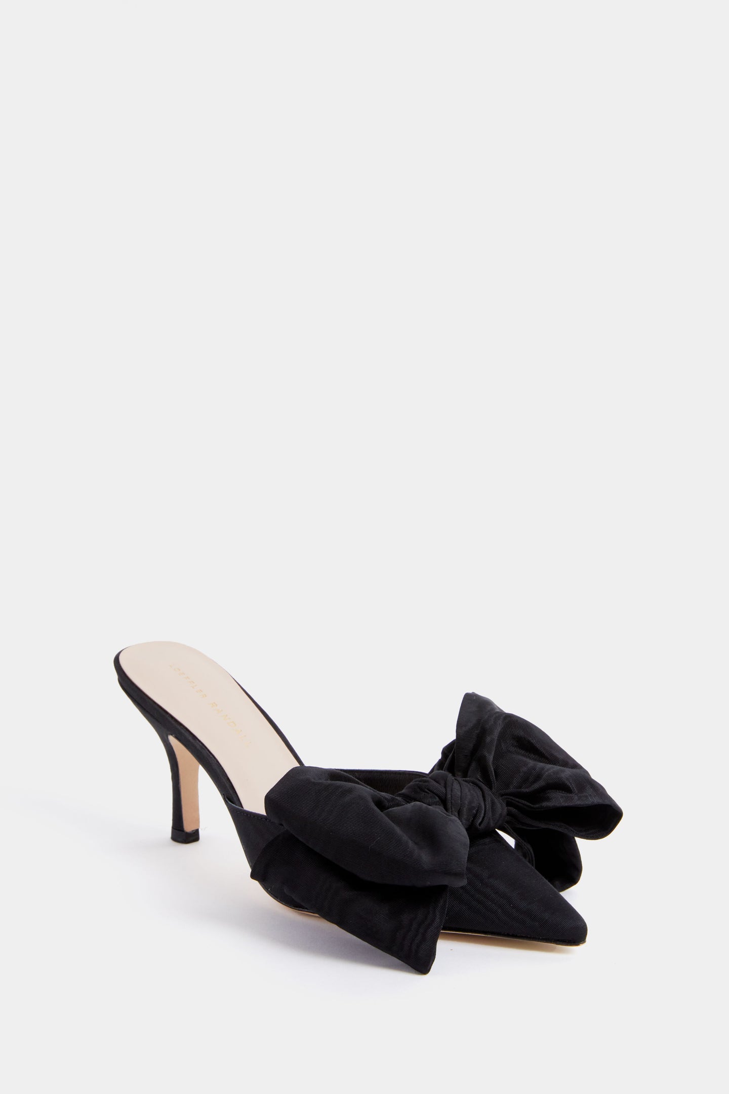 Loeffler Randall black pointed toe mule with a stiletto kitten heel, accented by large fabric bows on the upper front for an elegant finish.