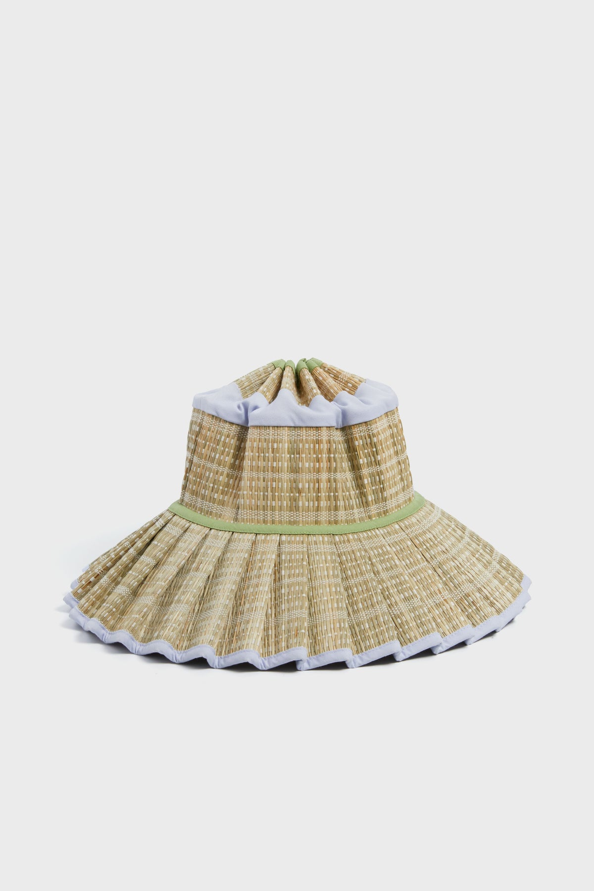 The Sail to Sable x Sarah & Molly woven straw sun hat, part of our resort collection, boasts a wide pleated brim, light green accents, white trim, and UPF 50+ protection for stylish sun safety.